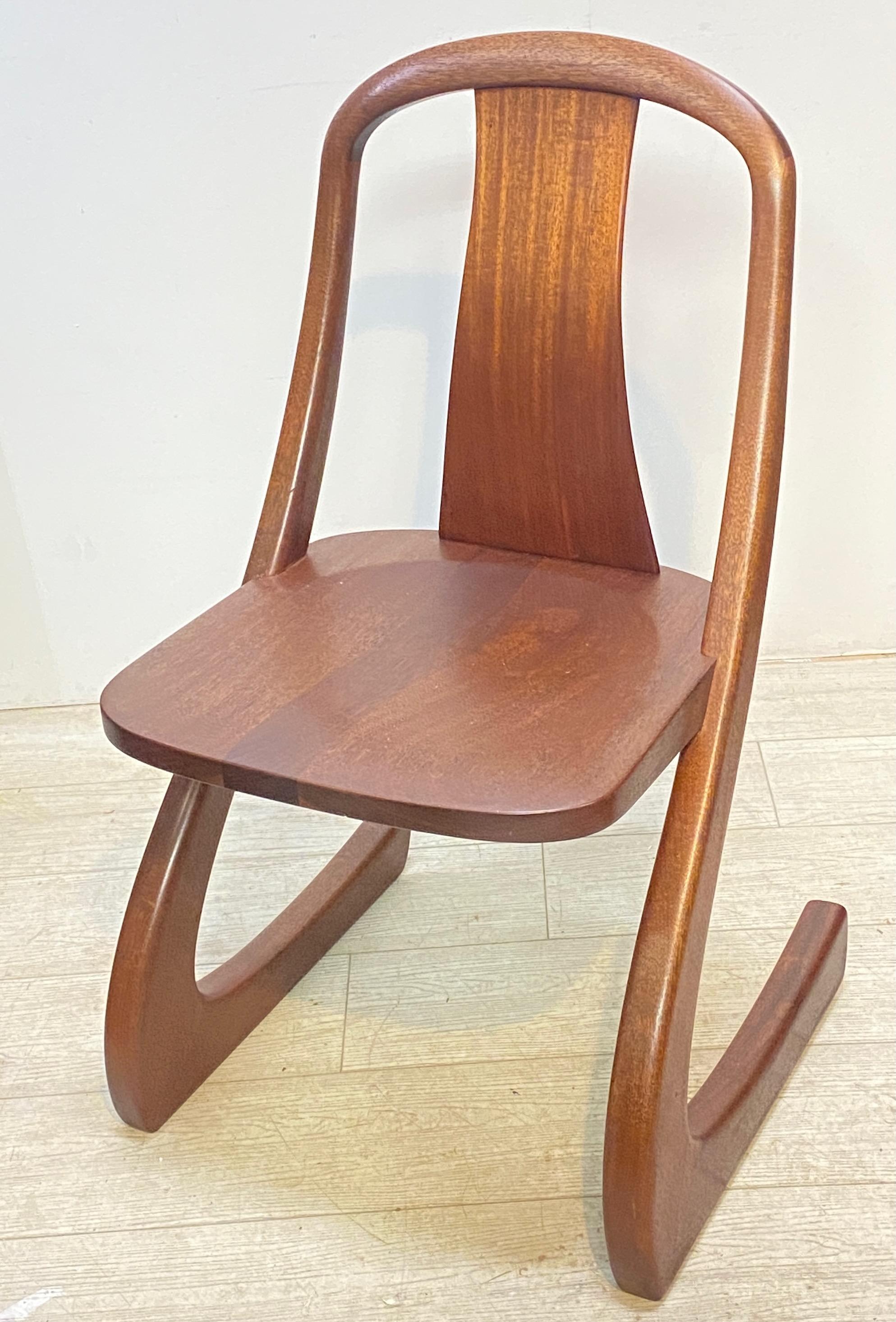 Solid mahogany Mid-Century Modern chair. Carved initials GS on the underside of the seat (maker unknown).
Sturdy and comfortable.
American, 1970's.