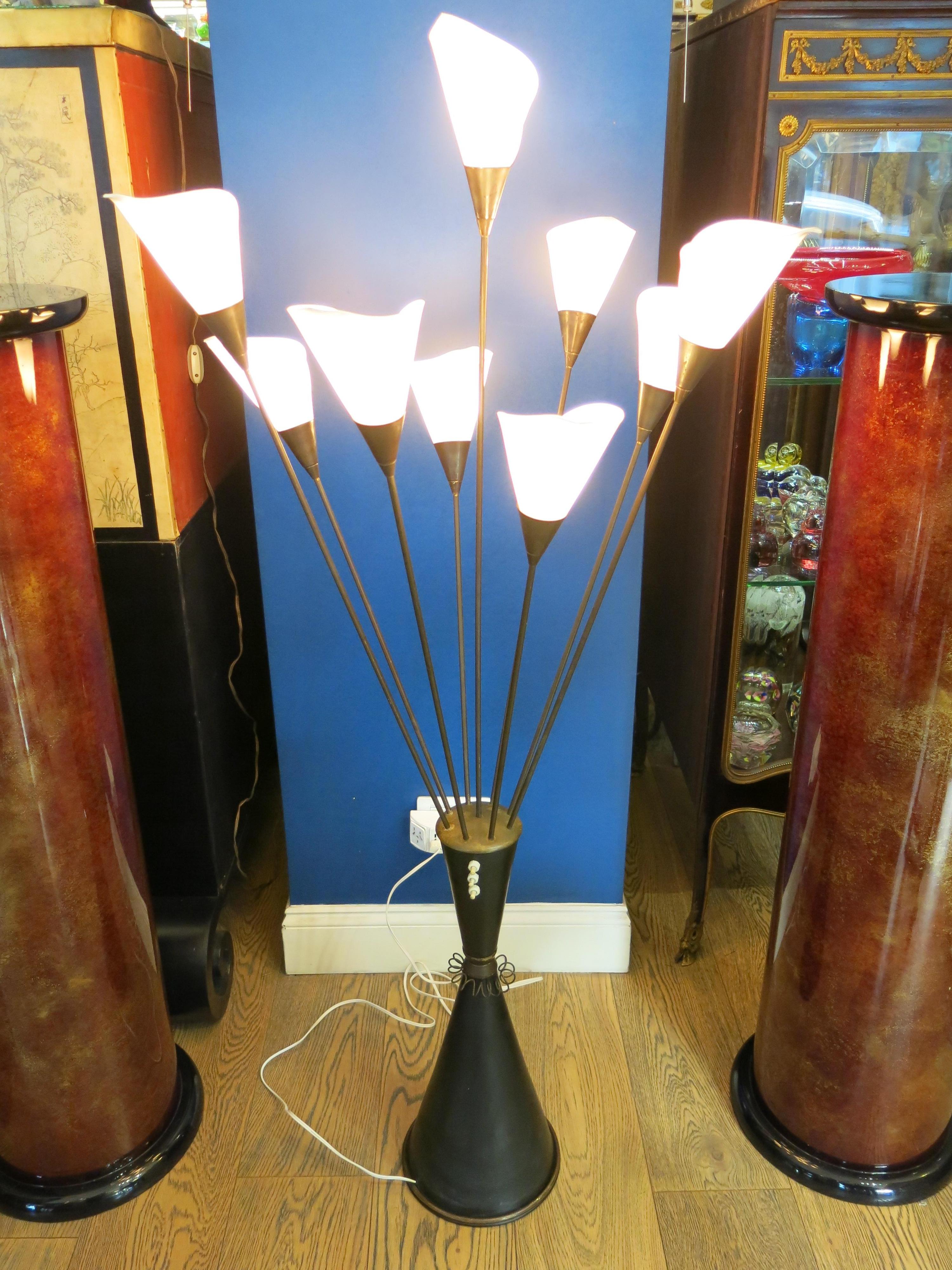 Step into the realm of mid-century modern elegance with this exquisite floor lamp by Angelo Lelli, a true testament to Italian design mastery. In impeccable condition, this stunning piece has been lovingly rewired with a sleek white cable,