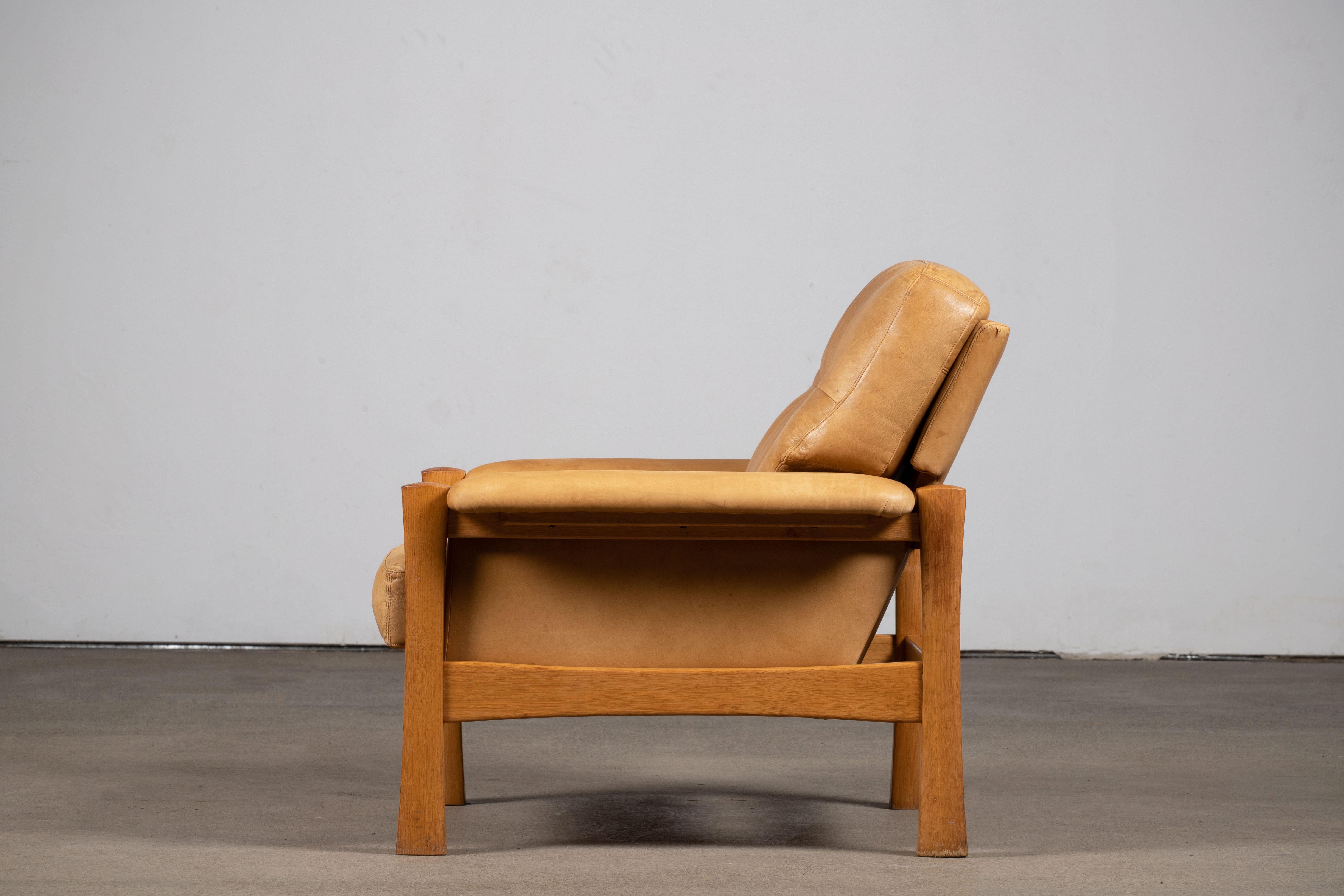 Inspired by Pierre Chapo, mid-century armchair in Camel leather featuring a superb patina, oak wood structure. Elegant design and great comfort.

 
