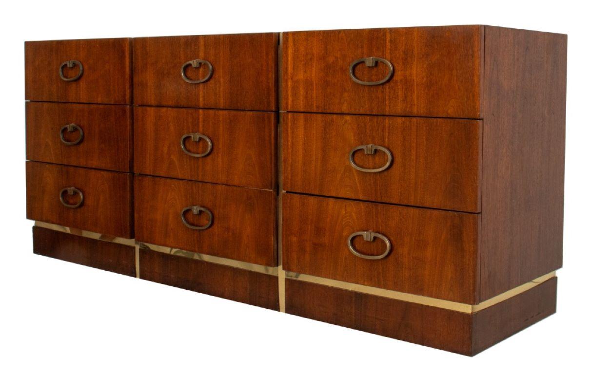 Mid-Century Modern walnut credenza or dresser, with nine drawers, three over three each with ring pulls above a brass-inlaid plinth.

Dealer: S138XX