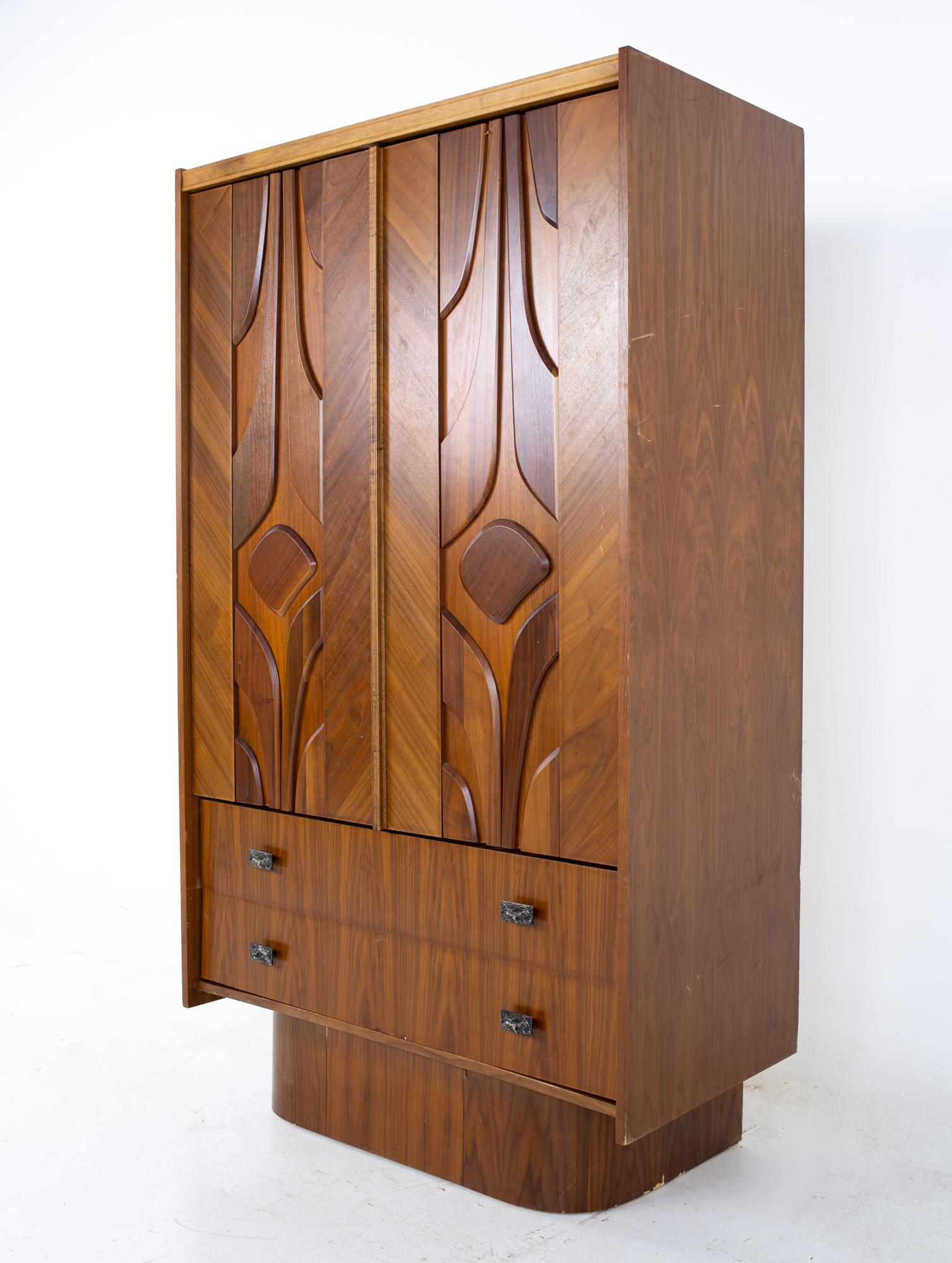 Mid Century Canadian Brutalist walnut armoire highboy dresser
Dresser measures: 39 wide x 20 deep x 66.5 inches high

All pieces of furniture can be had in what we call restored vintage condition. That means the piece is restored upon purchase so