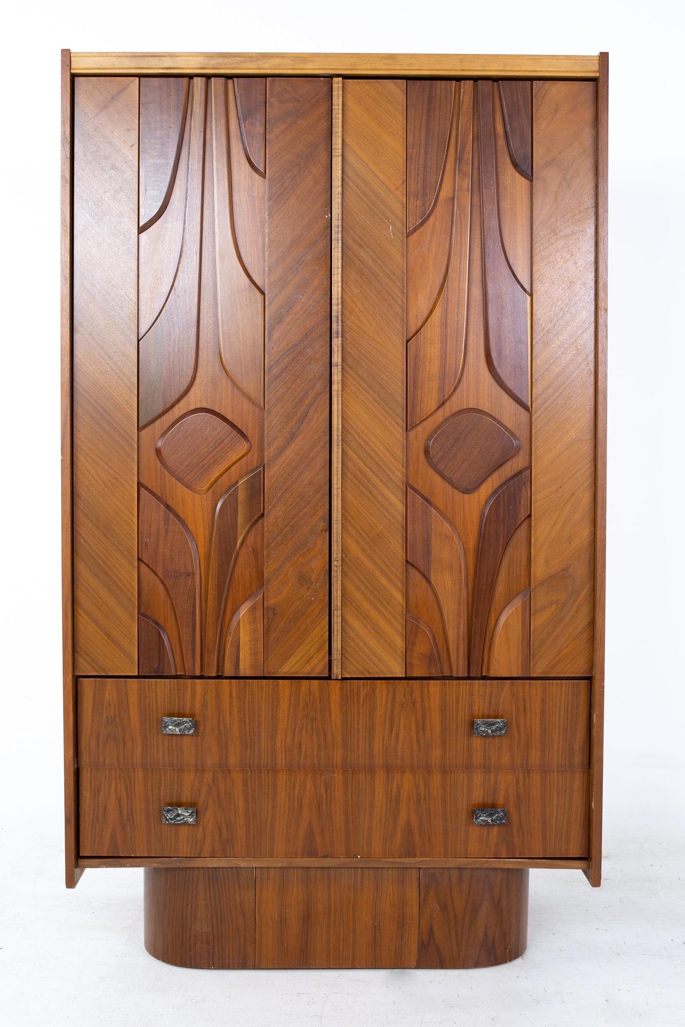 Mid-Century Canadian Brutalist walnut armoire highboy dresser.

Dresser measures: 39 wide x 20 deep x 66.5 inches high.

All pieces of furniture can be had in what we call restored vintage condition. That means the piece is restored upon