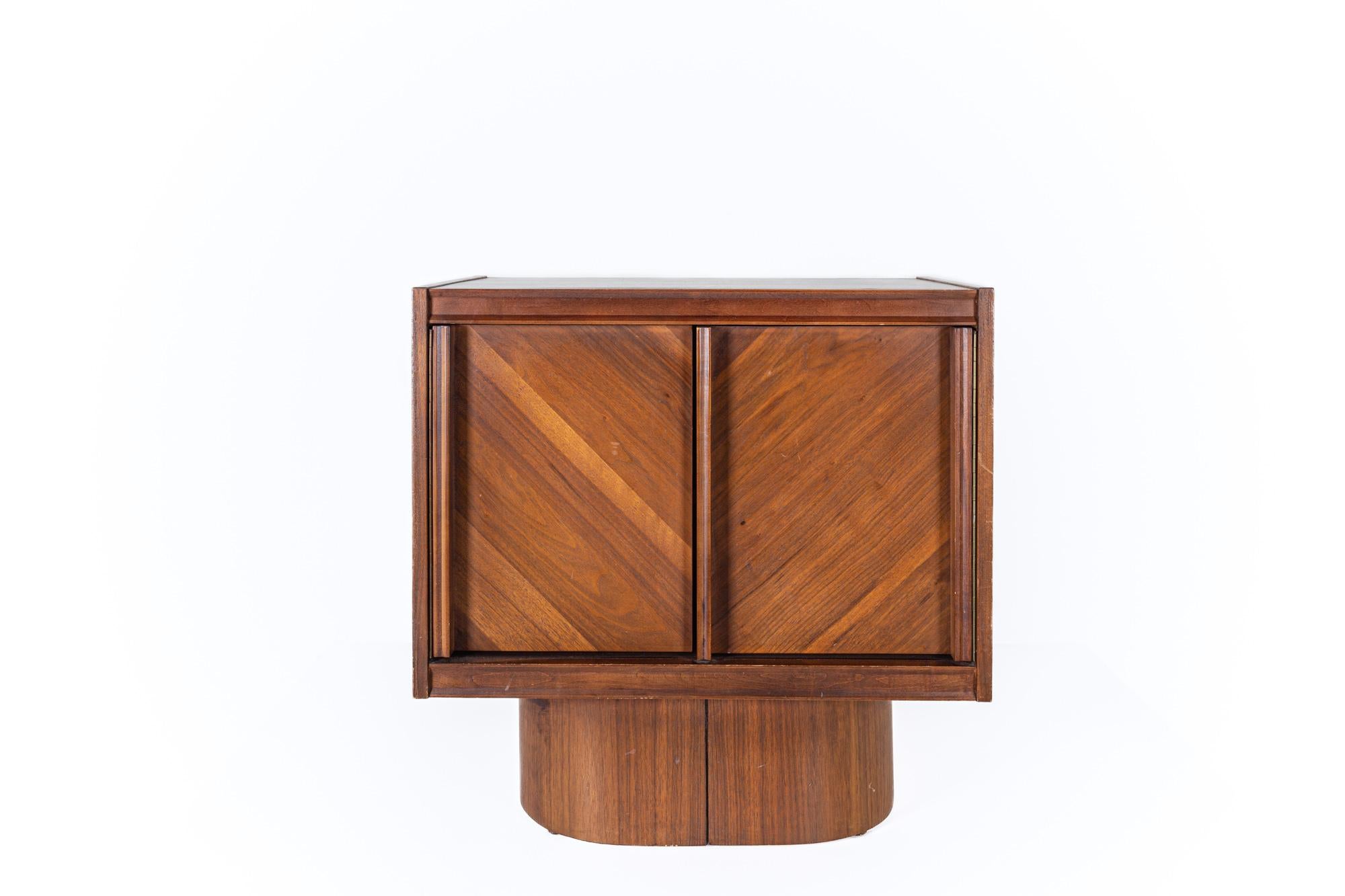 Mid century Canadian Brutalist walnut nightstand

This nightstand measures: 25 wide x 17 deep x 25 inches high

All pieces of furniture can be had in what we call restored vintage condition. That means the piece is restored upon purchase so it’s