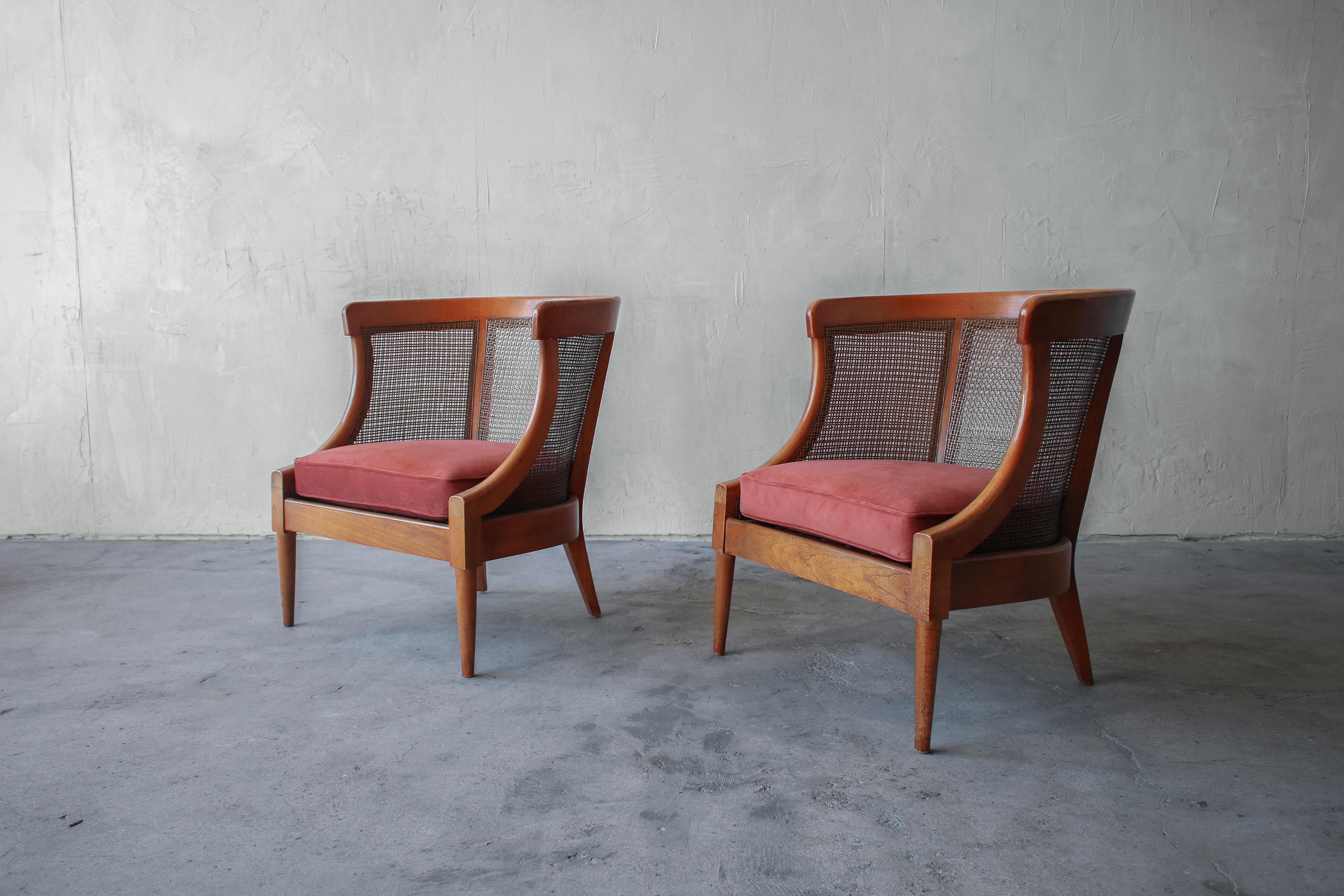 Pair of exquisite cane lounge chairs by Tomlinson. 

The chairs are in beautifully patinaed condition with some slight wear to the cane and wood, they have been reupholstered with new seat foam in a gorgeous rust colored, cotton velvet. The cane