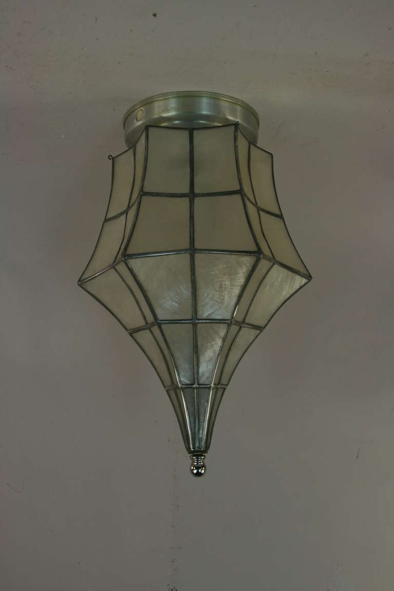 Handmade capiz shell flushmount.
Takes 75 watt Edison based bulb.