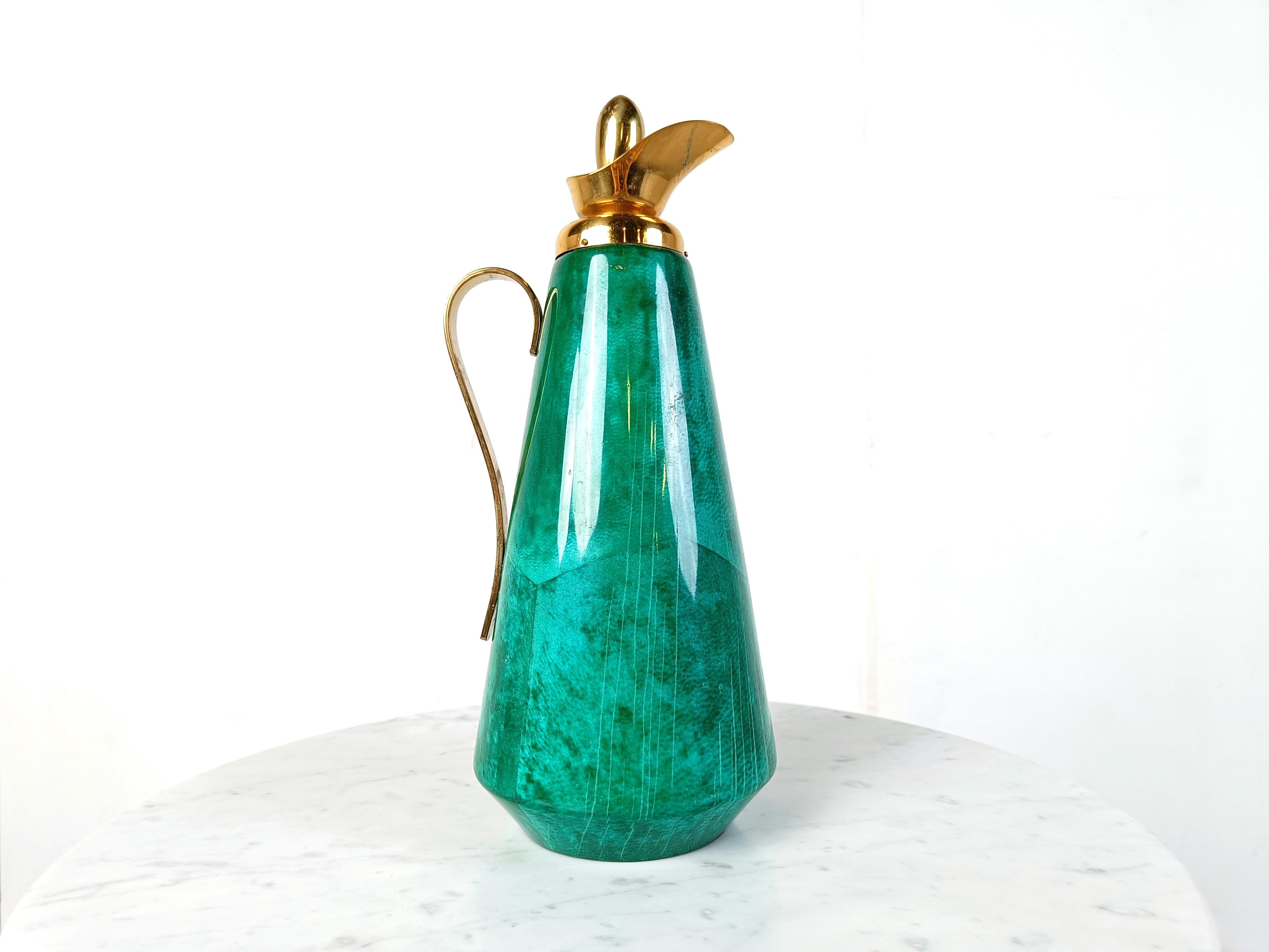 Vintage carafe by Aldo tura made from lacquered goatskin in a nice green colour and brass hardware..

Elegant shaped carafe with a beautiful colour

Good looking vintage addition for your bar. 

1960s - Italy

Labeled underneath

Height:
