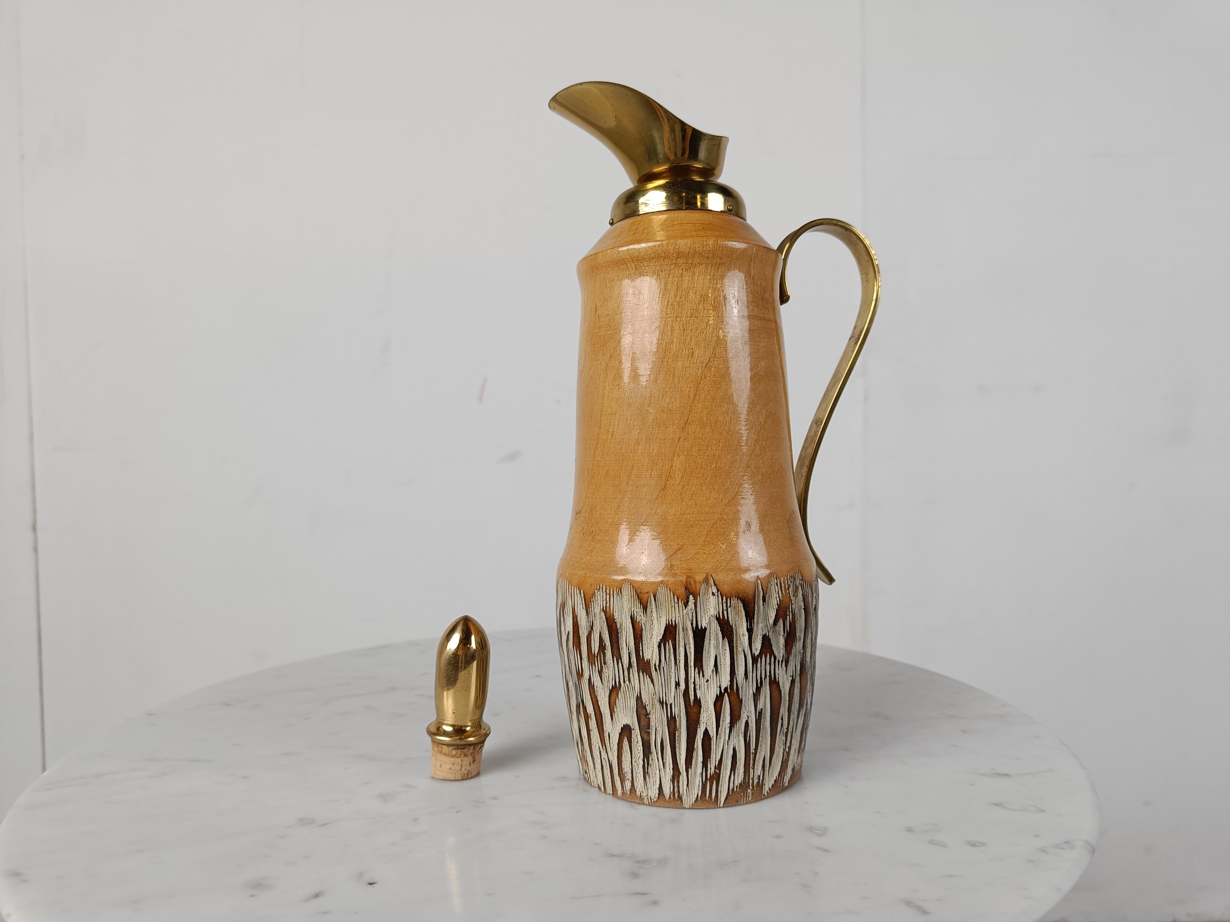 Vintage carafe by Aldo tura.

Elegant shaped piece with textured wood and brass hardware.

Good looking vintage addition for your bar. 

1960s - Italy

Labeled underneath

Height: 30cm/11.81