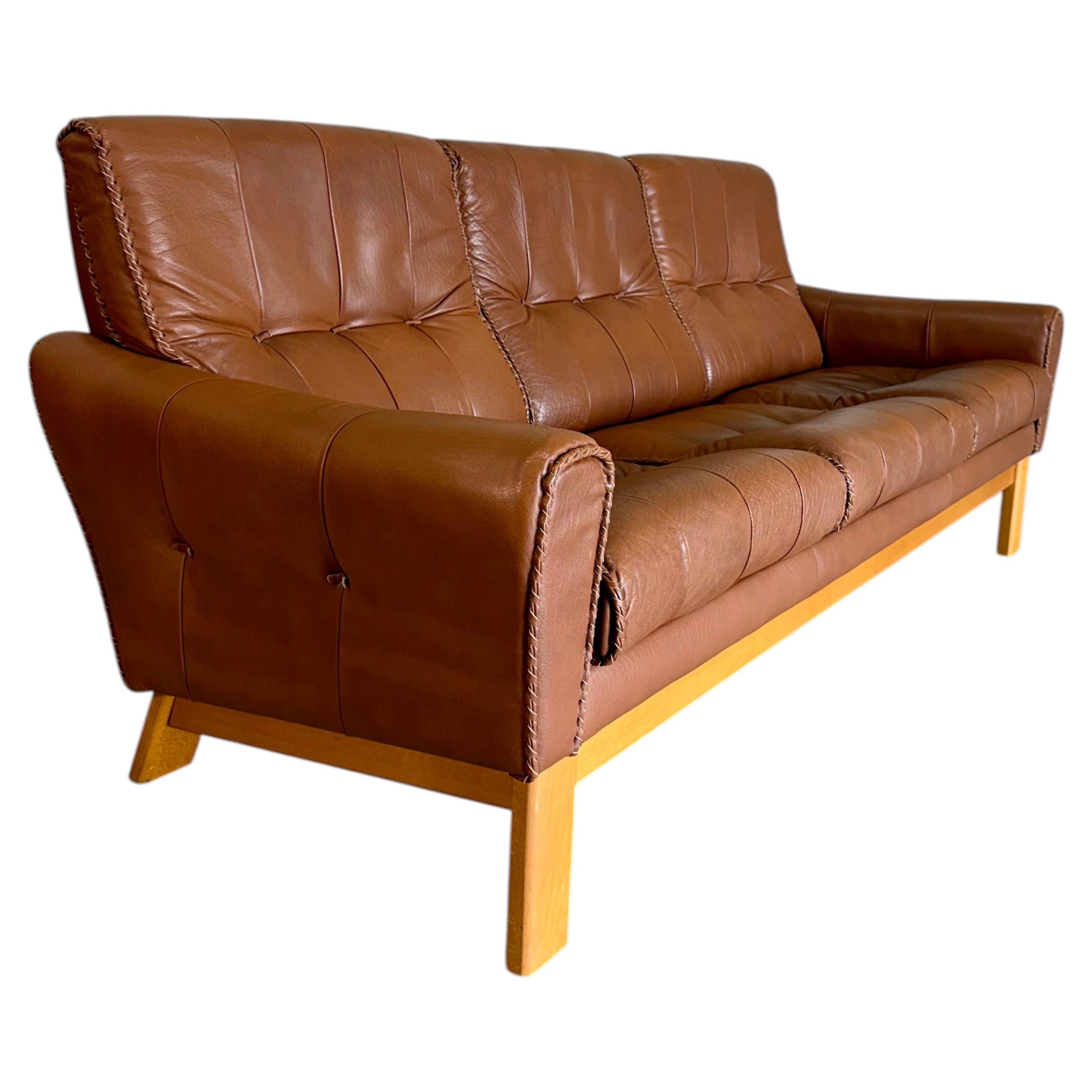 Mid Century Caramel Leather and Beech Sofa with Baseball Glove Stitching For Sale