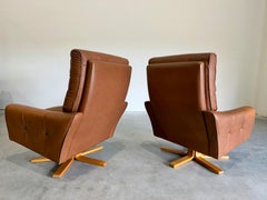 Mid Century Caramel Leather and Beech Swivel Chairs, Baseball Glove Stitching