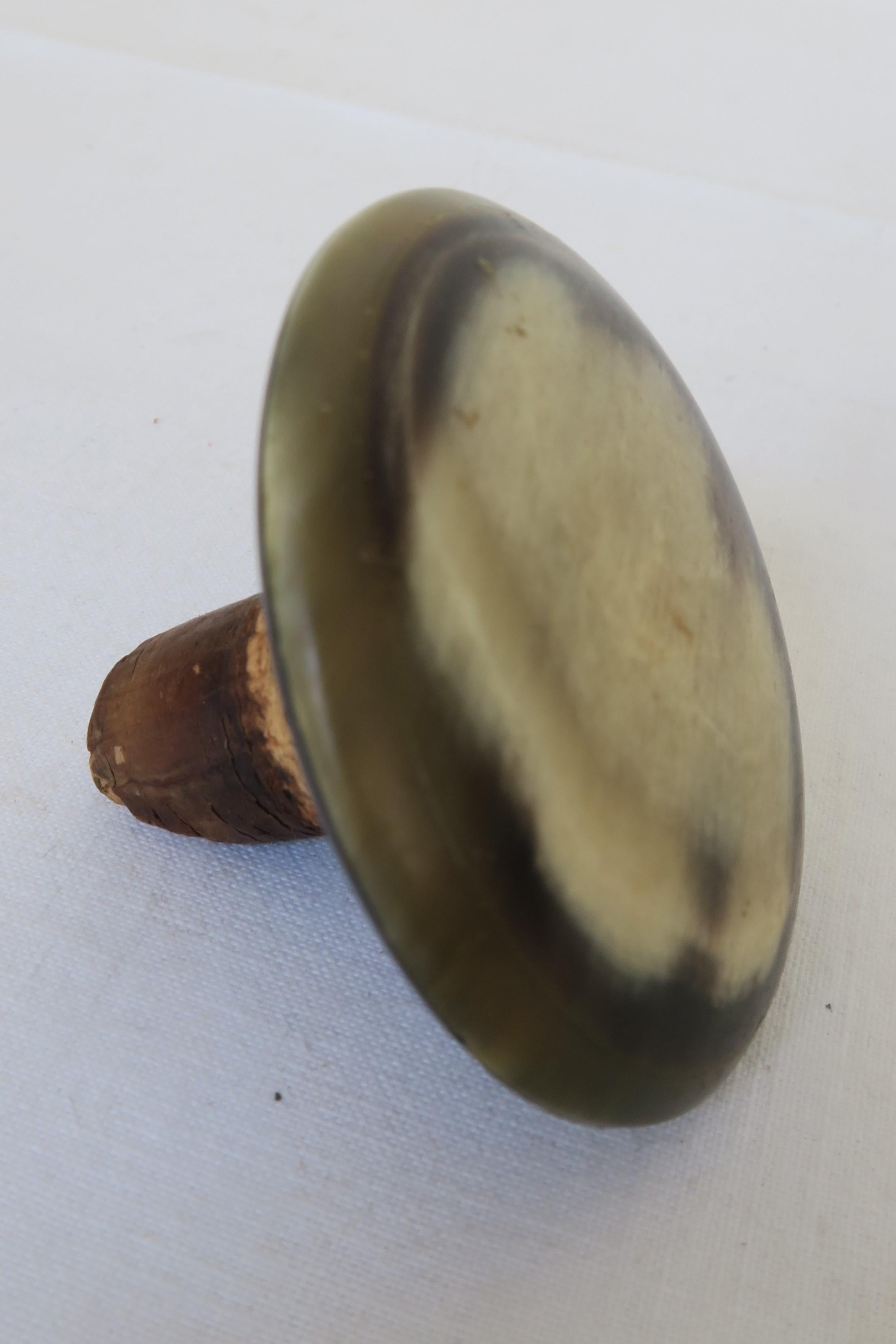For sale is a unique piece of Mid-Century Modern design. The bottle stopper was carefully hand carved out of horn. They were produced in the renowned Austrian workshops of Bauhaus-influenced designer Carl Auböck. The polished base of the bottle