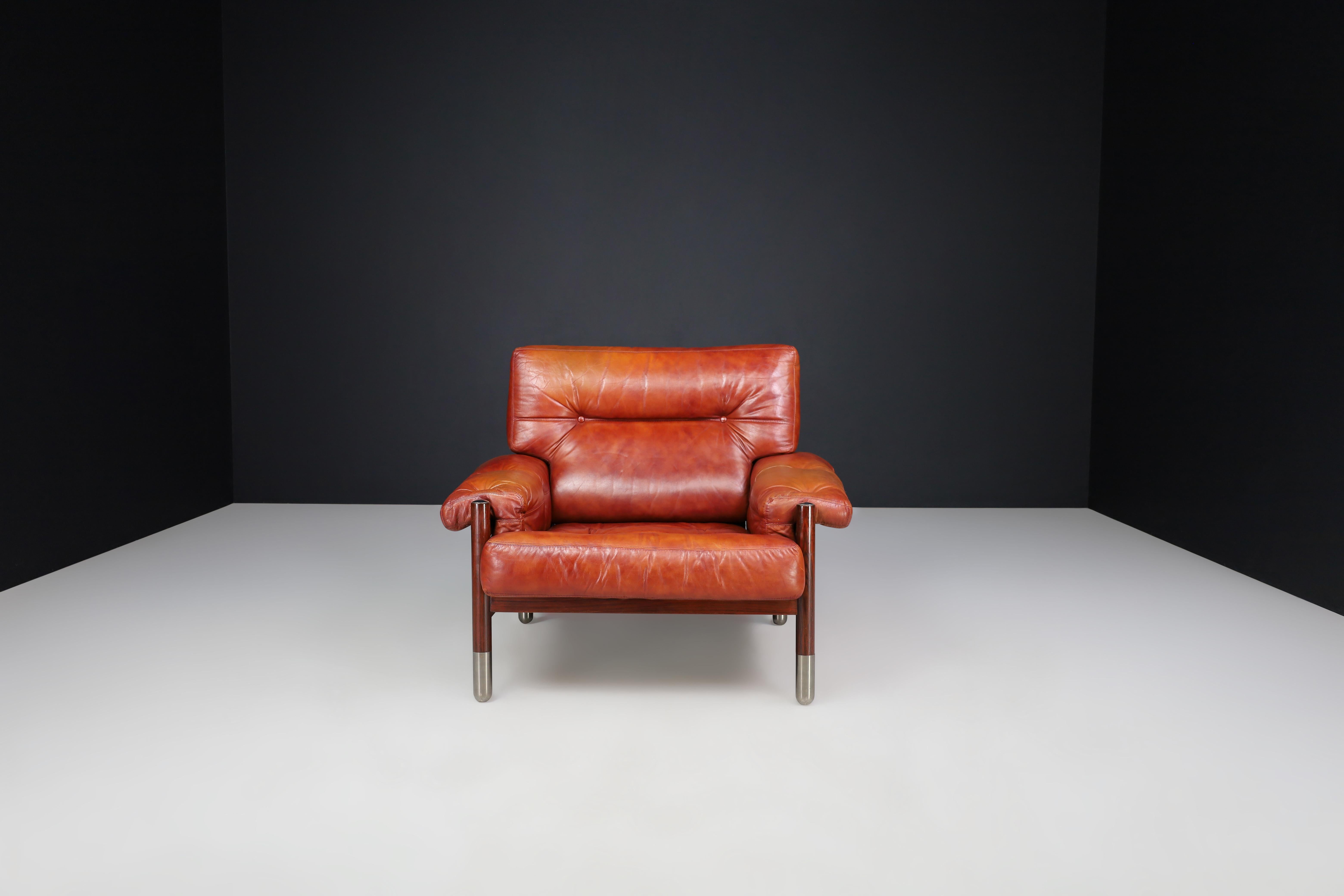 Italian Mid-Century Carlo de Carli Leather lounge chair and ottoman, Italy 1970s For Sale