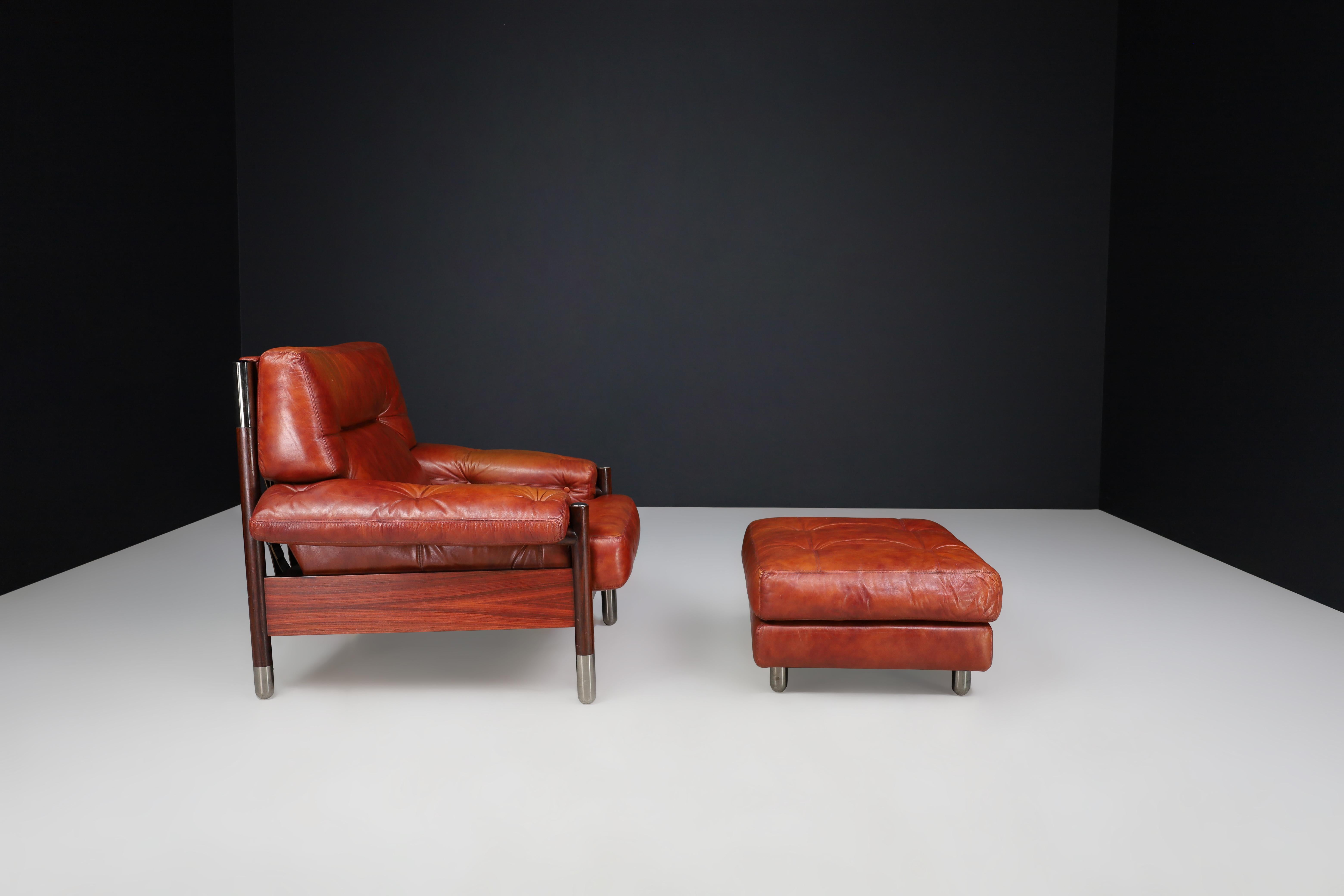 Late 20th Century Mid-Century Carlo de Carli Leather lounge chair and ottoman, Italy 1970s For Sale