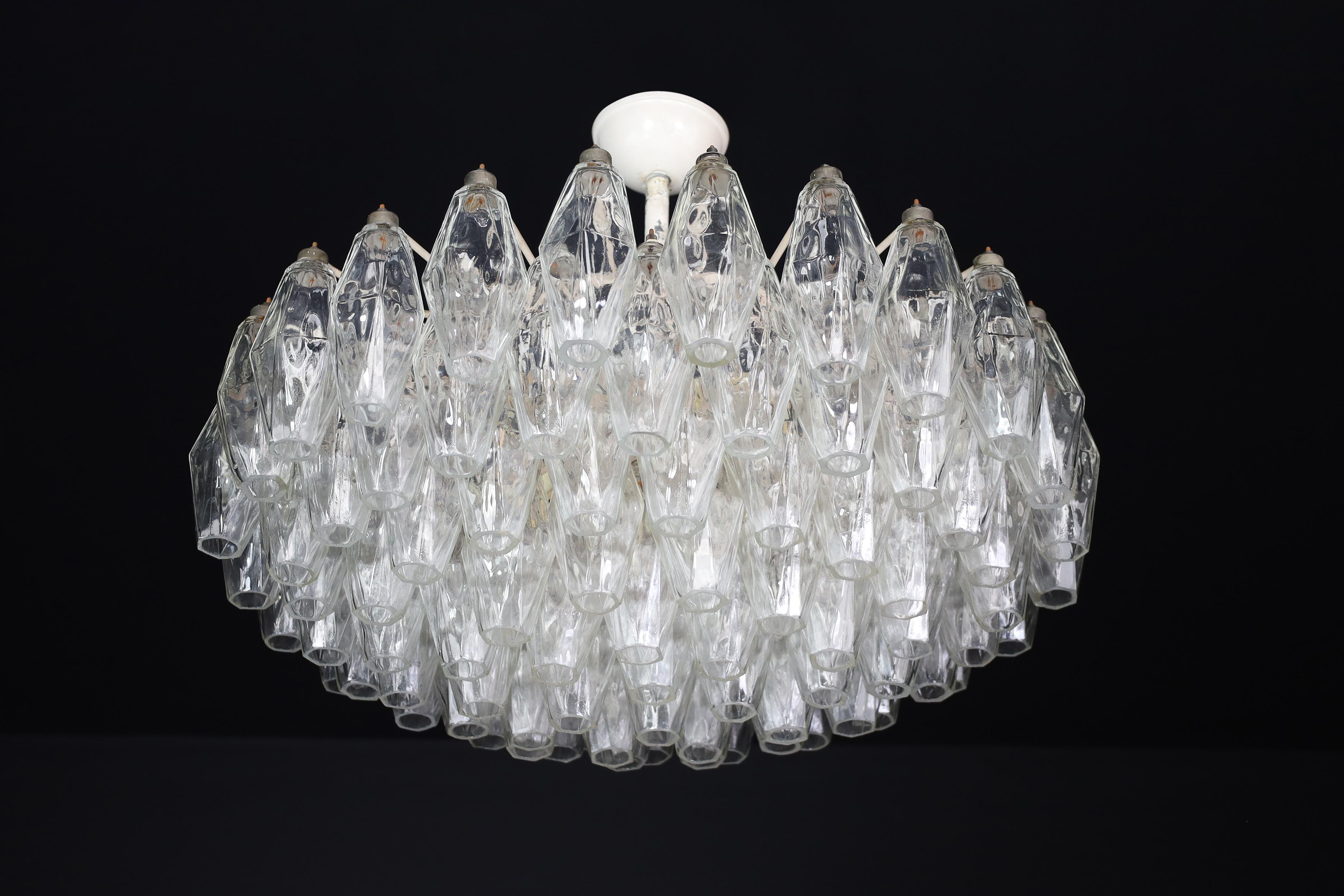 MiCarlo Scarpa Poliedri Chandeliers for Venini, Murano, Italy, 1960s.

We have two exquisite mid-century Venini Murano glass chandeliers for sale, designed by Carlo Scarpa in Italy in the 1950s. The chandeliers feature an impressive array of