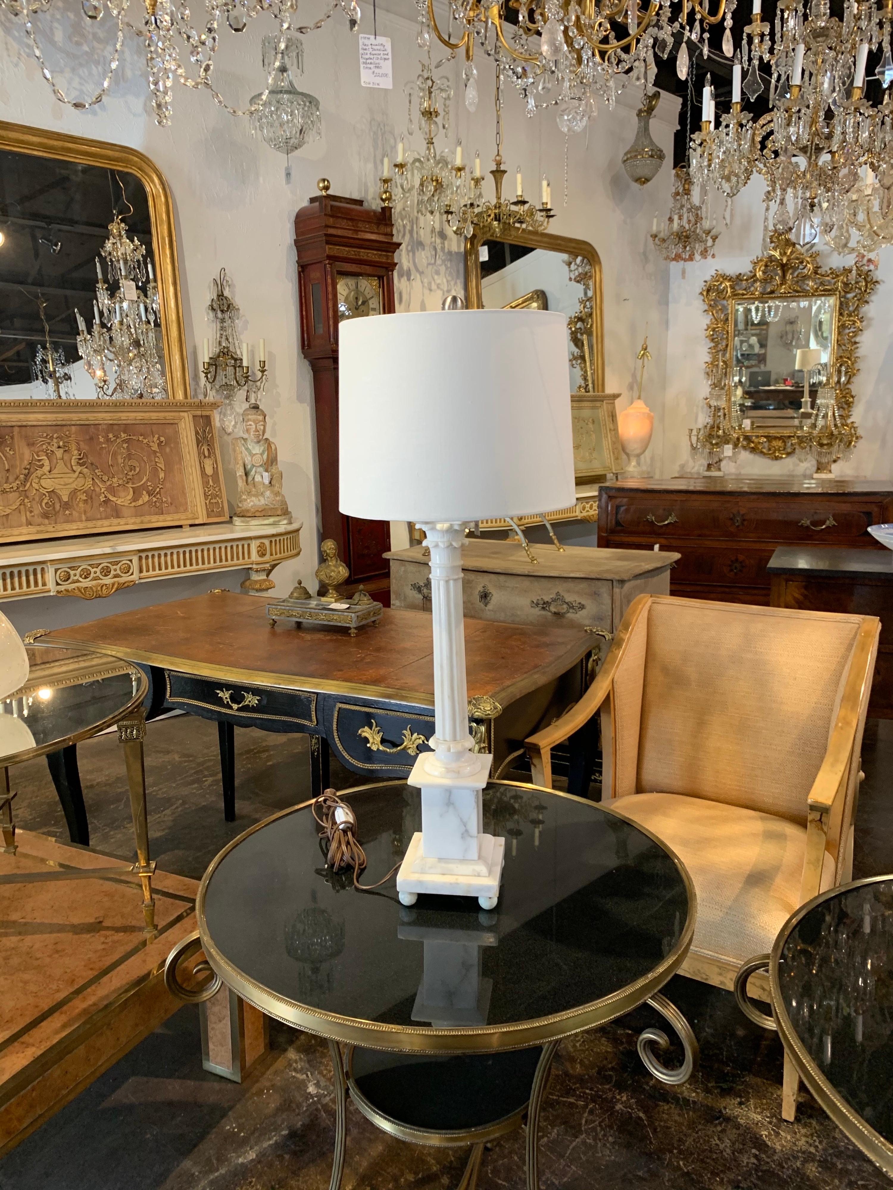 Lovely midcentury Carrara marble table lamp. Very elegant lines to this piece. And the lamp is wired and ready to go and has a beautiful lamp shade.