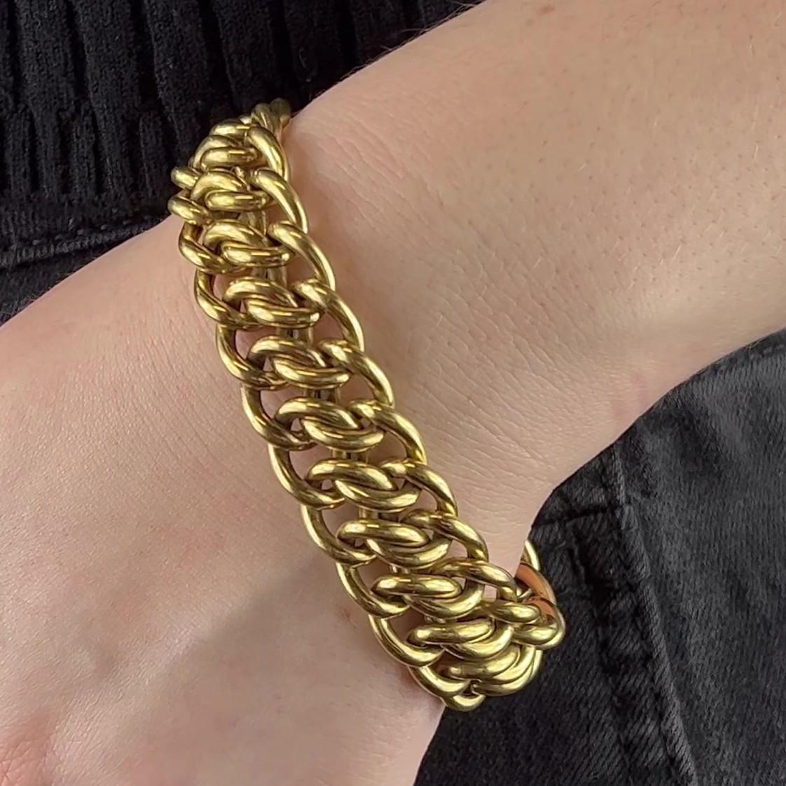 One Mid Century Cartier 18 Karat Gold Bracelet. Crafted in 18 karat yellow gold, signed Cartier Paris, with French hallmarks, serial #04295. Circa 1960s. The bracelet measures 7 3/4 inches in length. 

About this Item: Adorn your wrist in pure