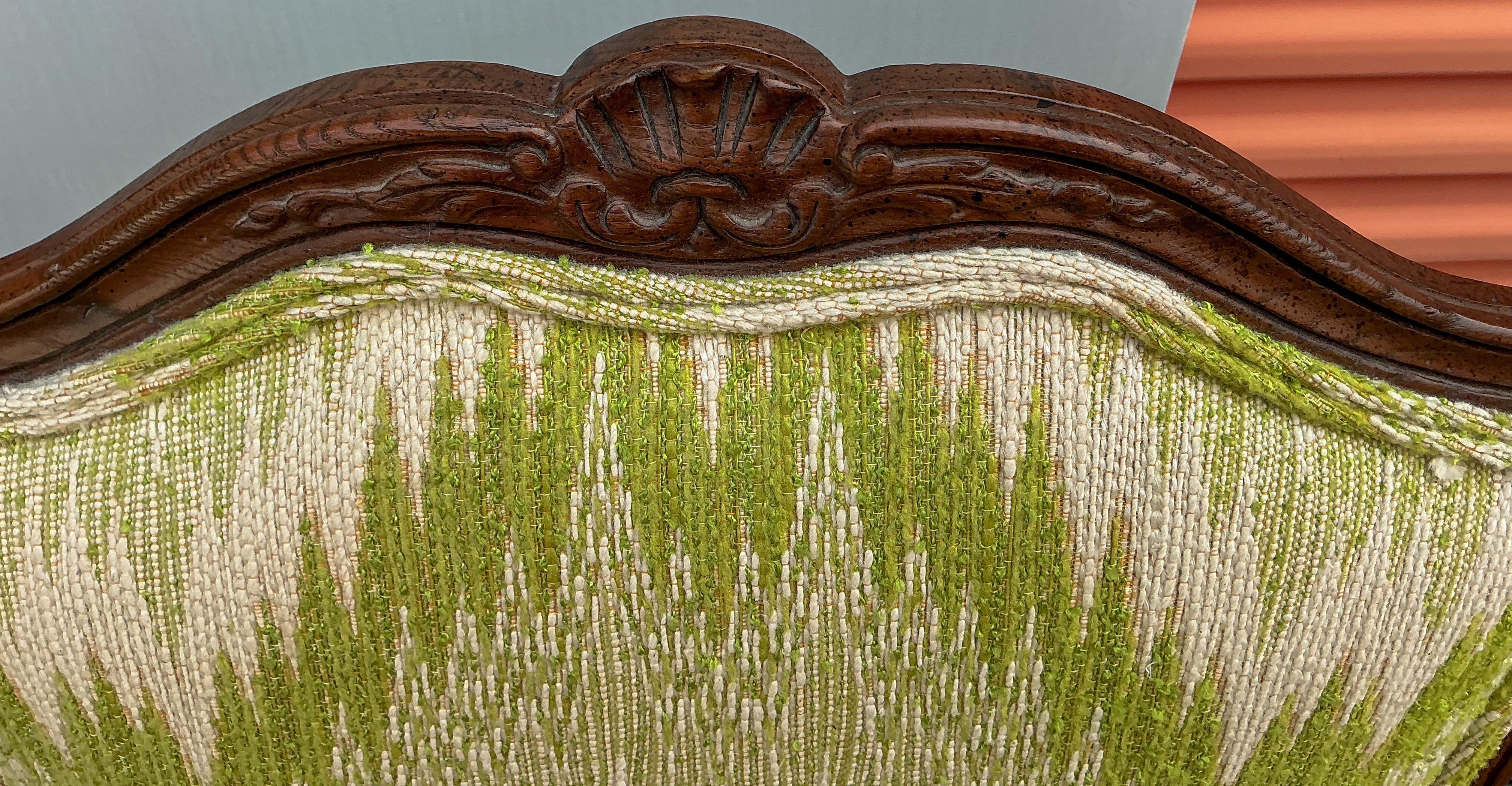 This is a pair of French Louis XIV style carved fruitwood bergere chairs in a vintage flame stitch upholstery. The chairs are believed to be Italian. They are unmarked. The upholstery is in nice shape and really charming. 

Shipping is running two