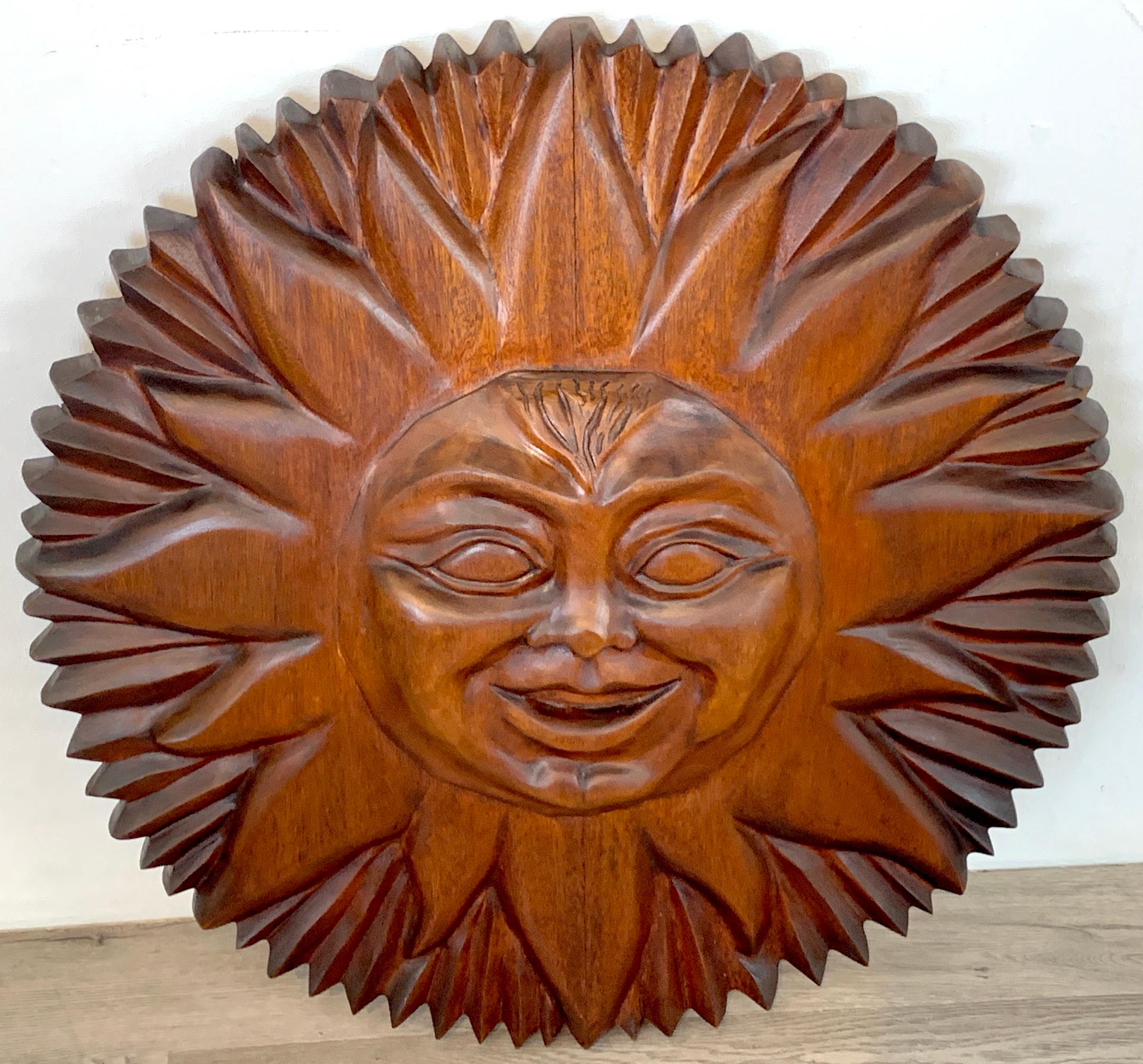 Midcentury carved mahogany sunburst, circa 1960s
Superb quality, finely carved detailed masterwork, showing influences of Sergio Bustamante and Pedro Friedeberg. Unmarked.
Fitted with two thick cast brass 17.5-Inch long brass cleats.
 
