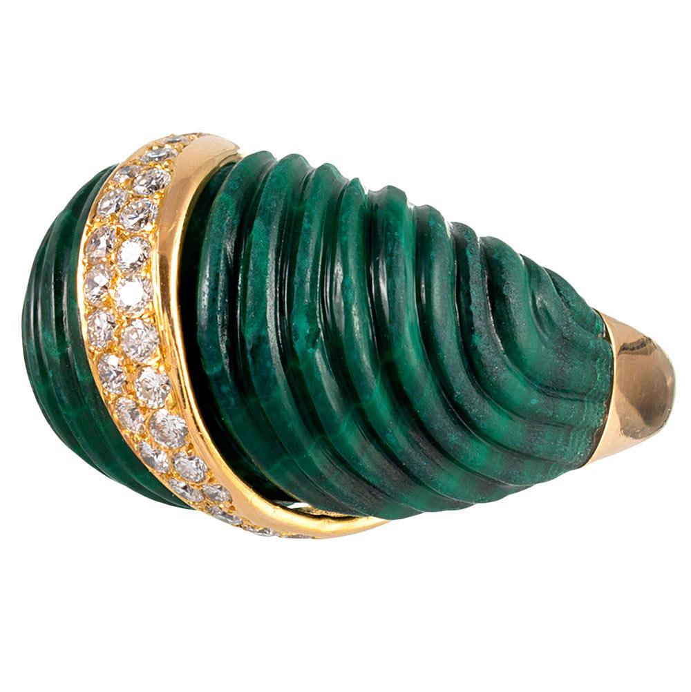 Ridged waves are carved into the richly-hued malachite, the design enhanced by a stroke of brilliant diamonds set into 18 karat yellow gold. This dome ring is reminiscent of the iconic designs of Van Cleef & Arpels and boasts French hallmarks, but