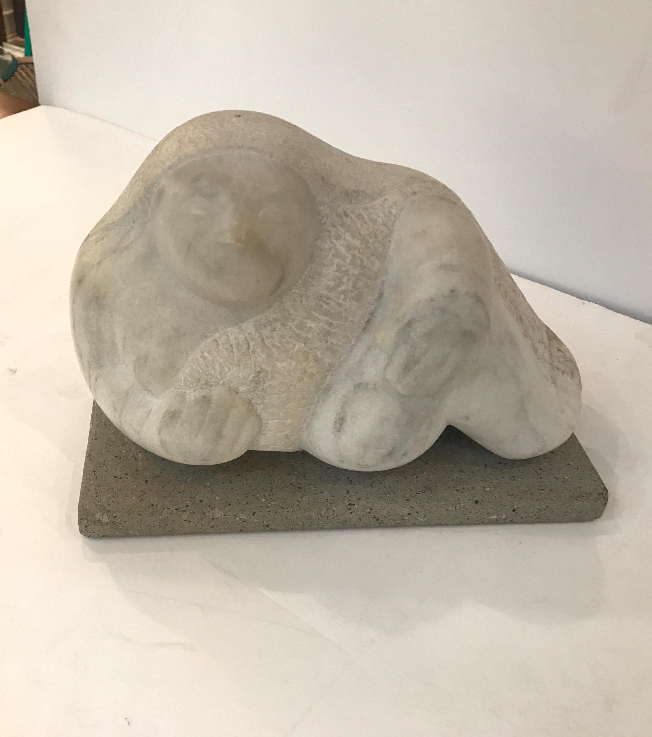 A mid-20th century hand carved marble and stone sculpture of a reclining figure. In the style of Botero signed illegibly on the back. The sculpture carved from solid marble with a stone base.
Measures: 11.5 wide, 5 deep, 8.5 high net 800.