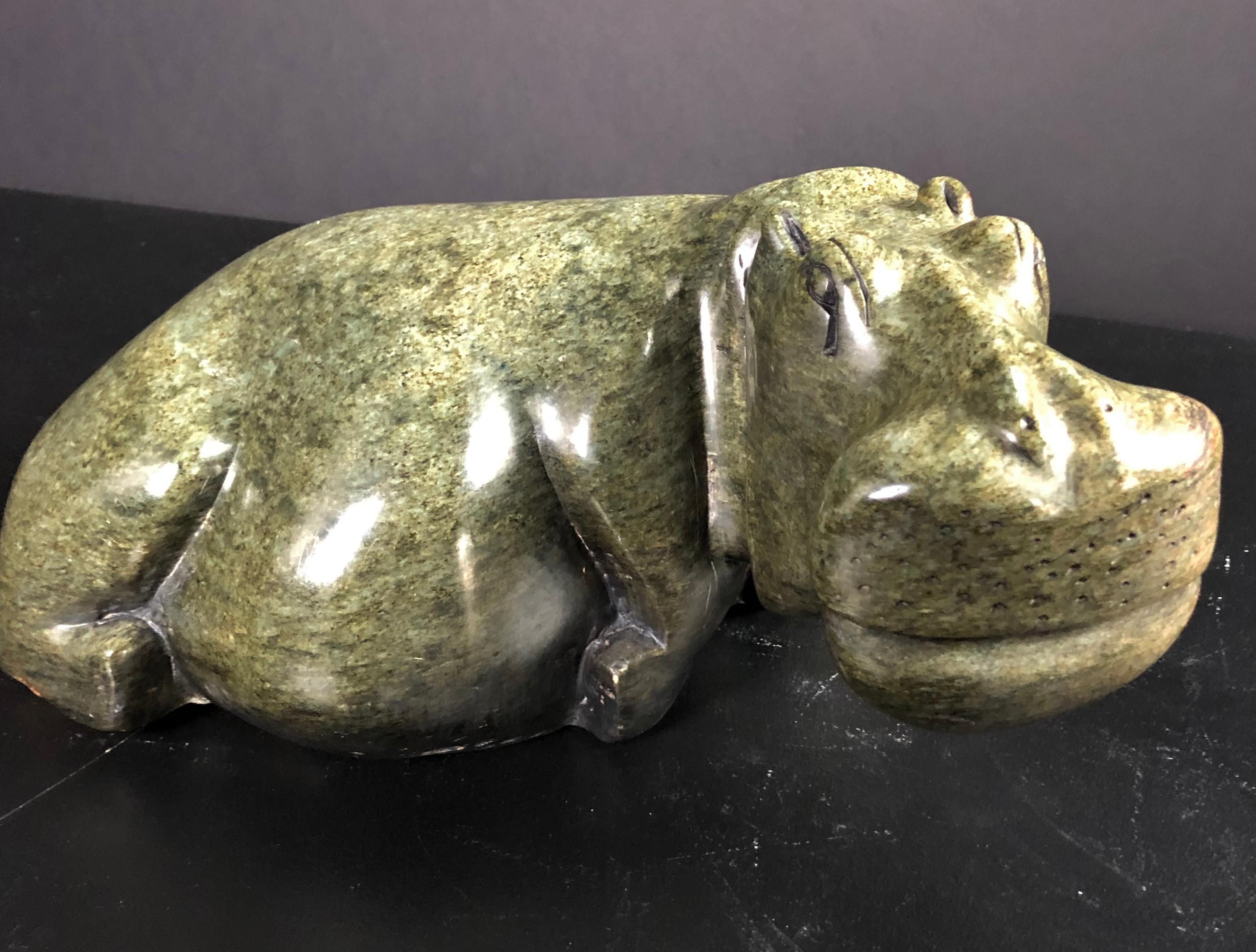 Mid century carved marble hippo sculpture. Modern sculpture of a hippopotamus carved from granite.