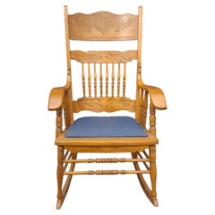 Mid-Century Carved Oak Press Back and Upholstered Seat Rocker Chair