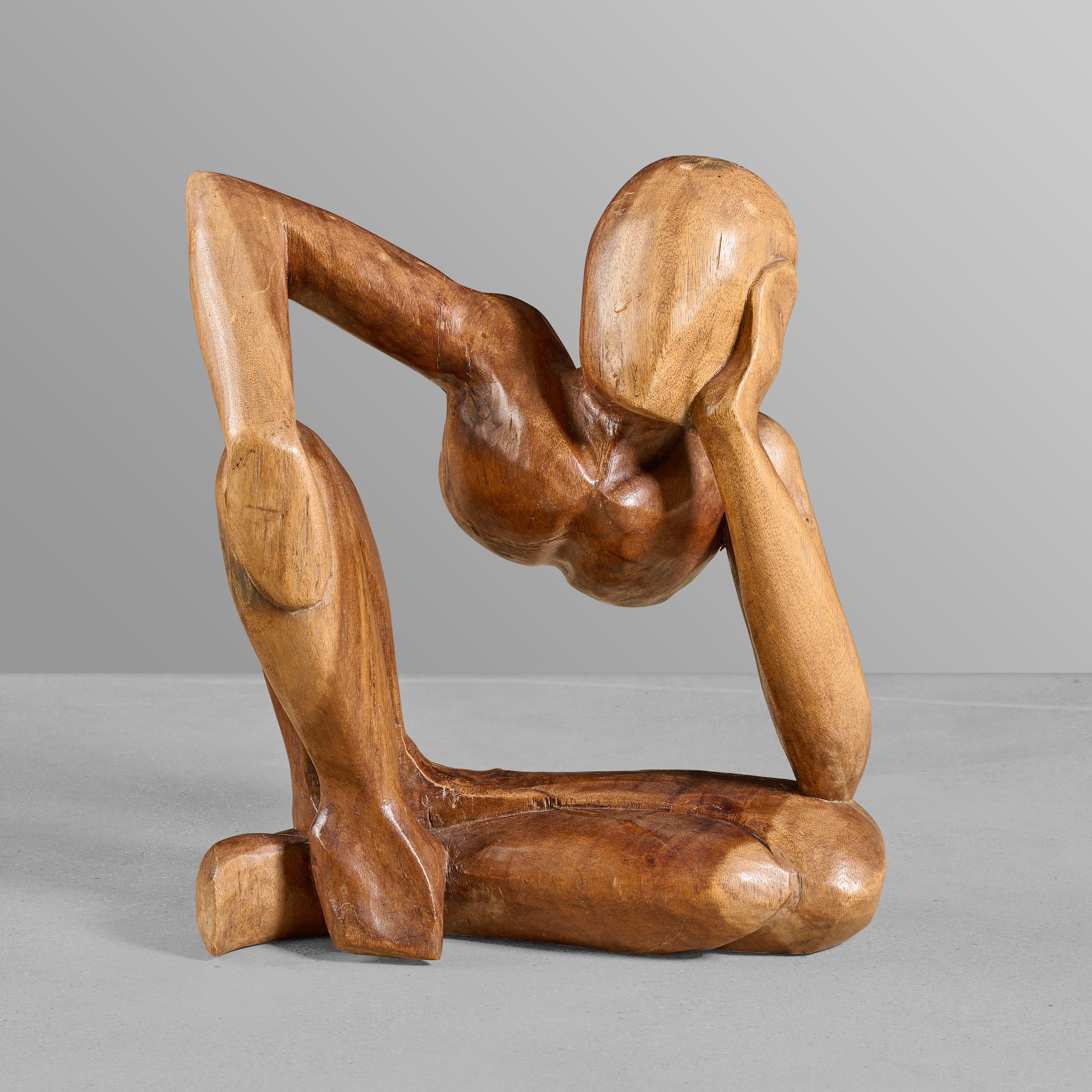 Mid-century carved wood sculpture of female figure. Carved from exotic wood.