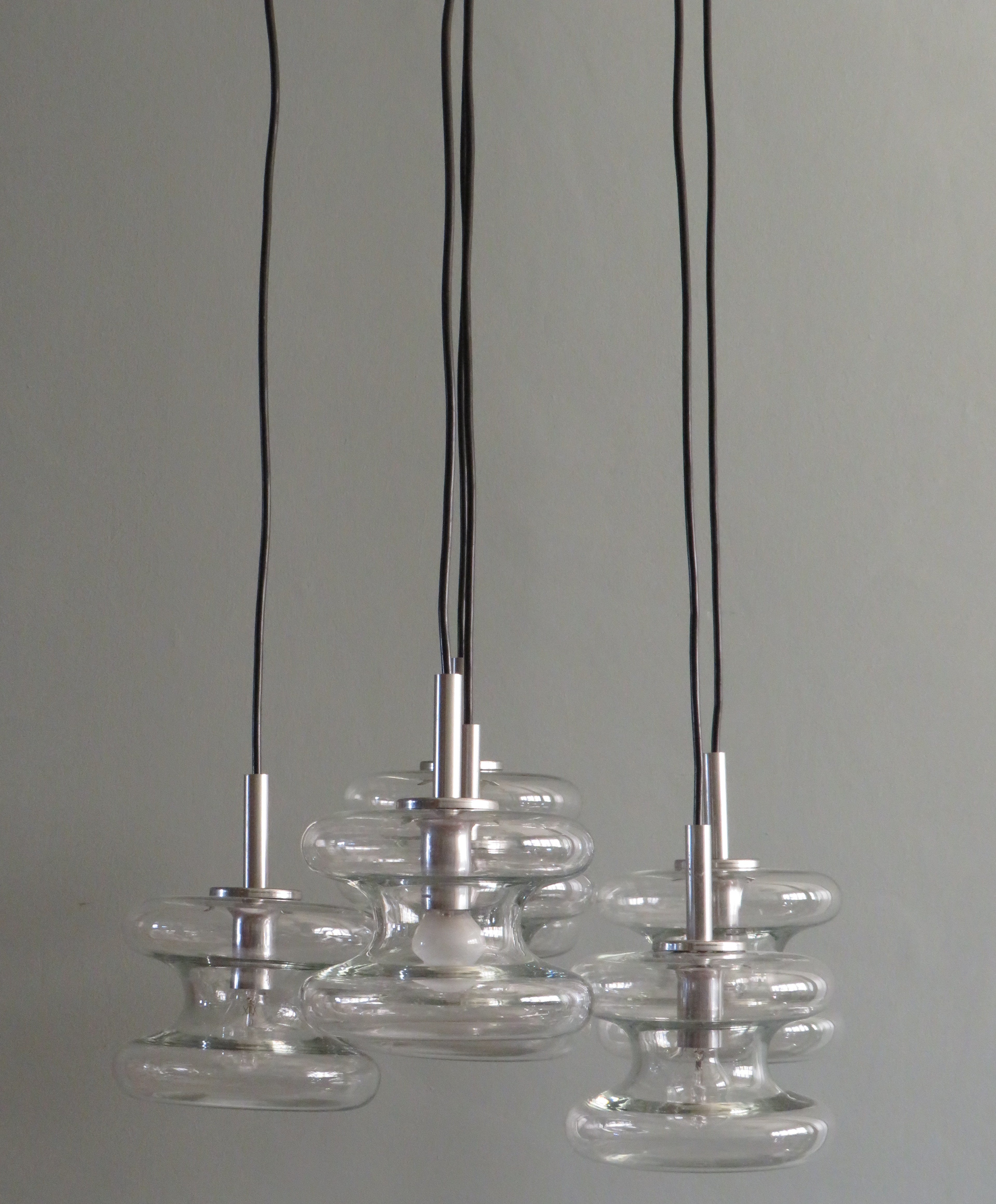 Mid century cascade chandelier by Doria Leuchten, Gemany 1960s.
This remarkable chandelier has 6 separate light points with closed glass shades.
The length of the lights can each be individually adjusted to the length of your choice.
The brushed