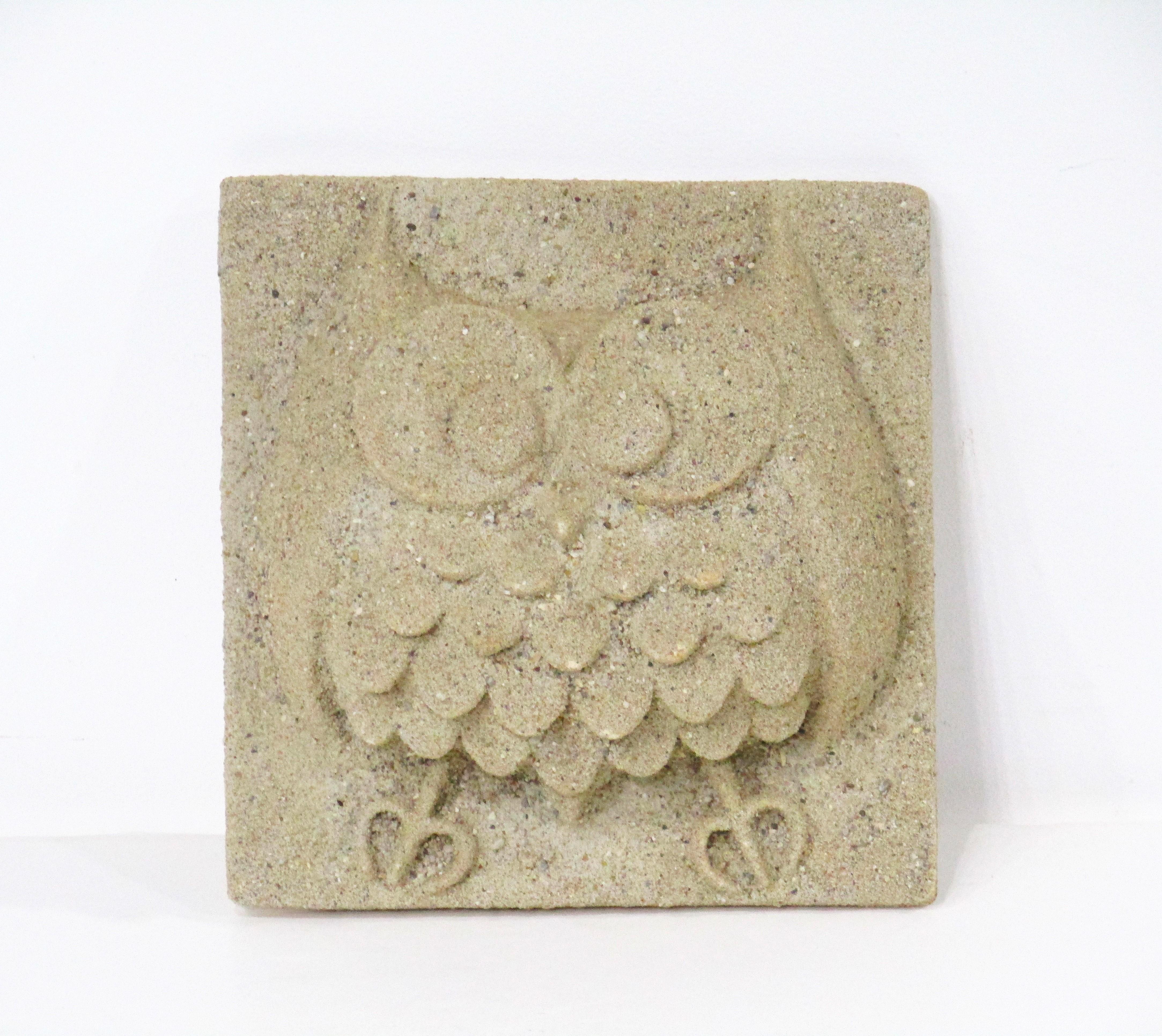 A mid century Owl wall sculpture made of a composite material and sand giving the piece a coastal and natural feel . Created by Barbara Field a black female artist and business woman who's designs animals and birds were sculpted by hand so no two