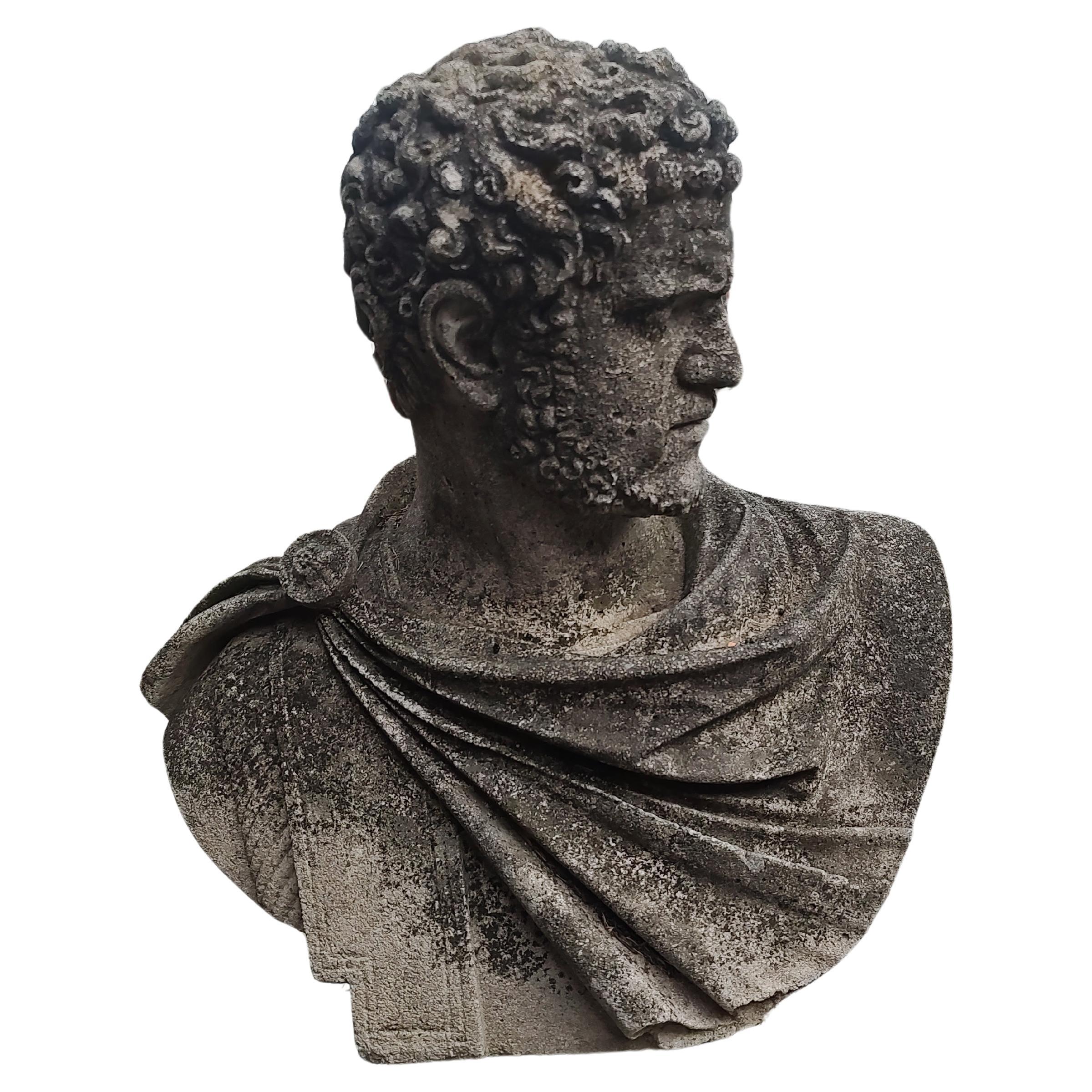 Fabulous cast limestone sculpture bust of a Roman dignitary, possibly Caesar or Augustus. Great detailed casting of stone with an angled pose in typical Roman garb. Fantastic hair! Patina is undisturbed and fabulous, even throughout. Pedestal not