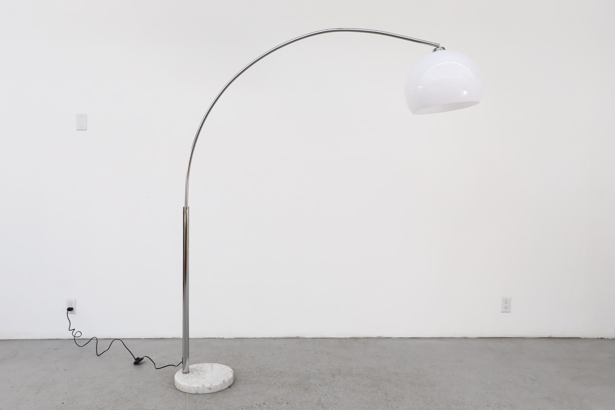 Mid-Century standing arc lamp with marble base, chrome stem and plexiglass dome shade. In original condition with visible wear consistent with its age and use. Other arc lamps are available and listed separately.