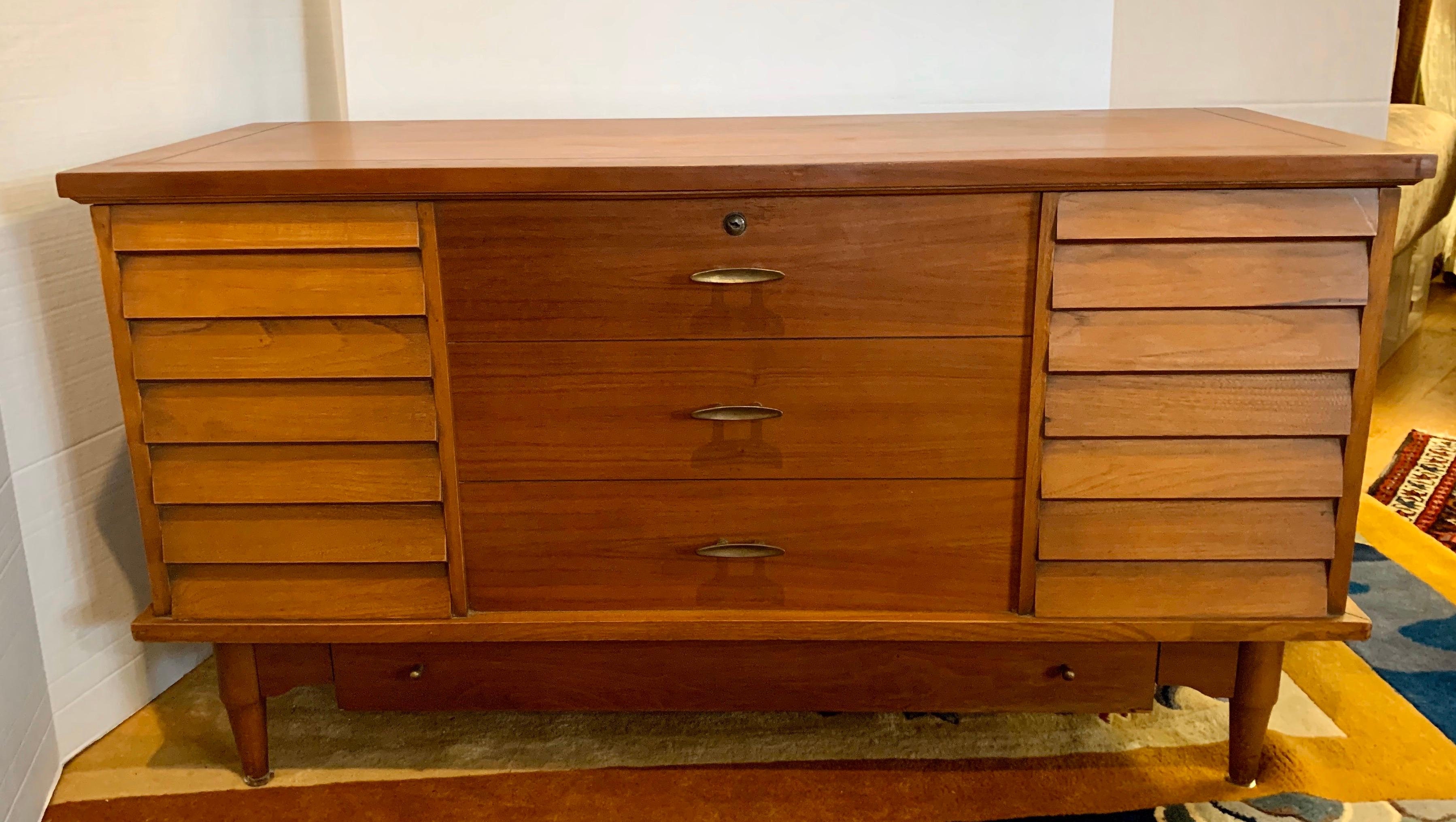 Iconic signed Lane Altavista cedar chest where top opens to a cedar storage compartment large enough for blankets, clothing, etc. What makes this unusual is the exterior design would make you believe it was something altogether different, i.e., the