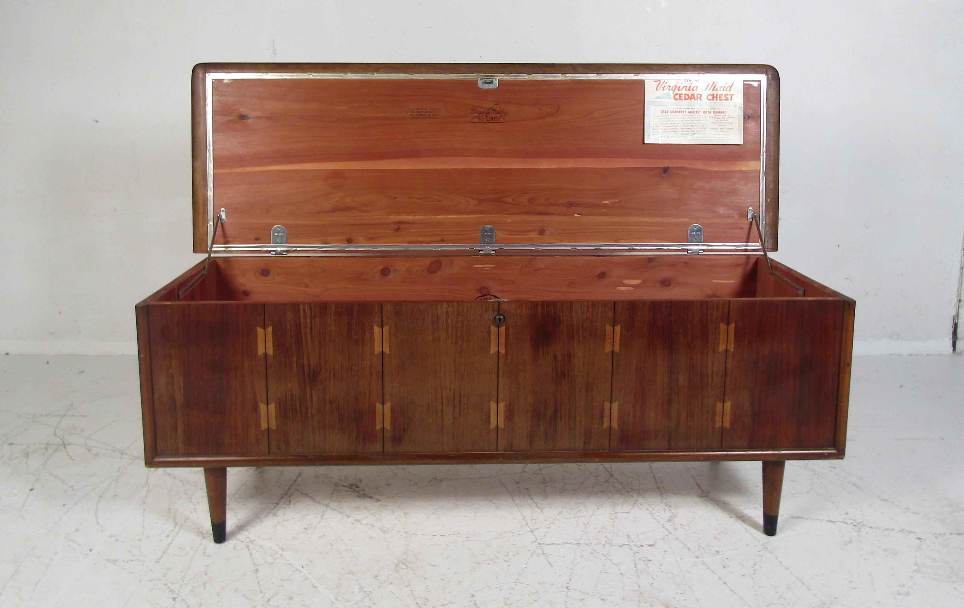 Nice midcentury cedar chest manufactured by Lane in Virginia. Walnut veneer exterior with decorative inlays on the chest's top. Pressure-treated cedar wood sure to keep any precious linens intact. Made in 1965. Please confirm item location with