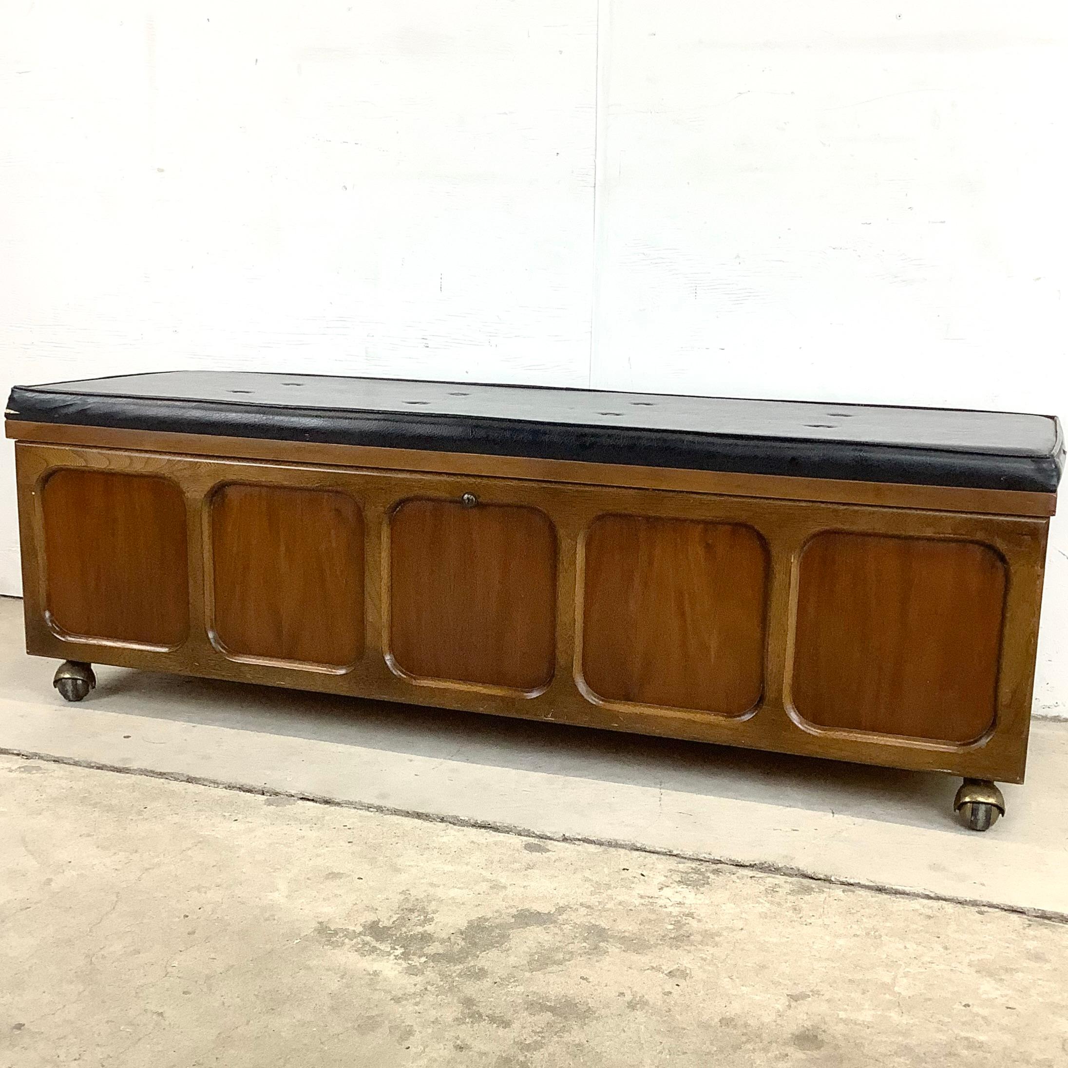 Introducing the Mid-Century Modern Lane Furniture Cedar Blanket Chest Bench on Wheels, a stylish and functional piece that combines mid-century charm, practicality, and mobility to add both storage and seating to your space.

Crafted by Lane