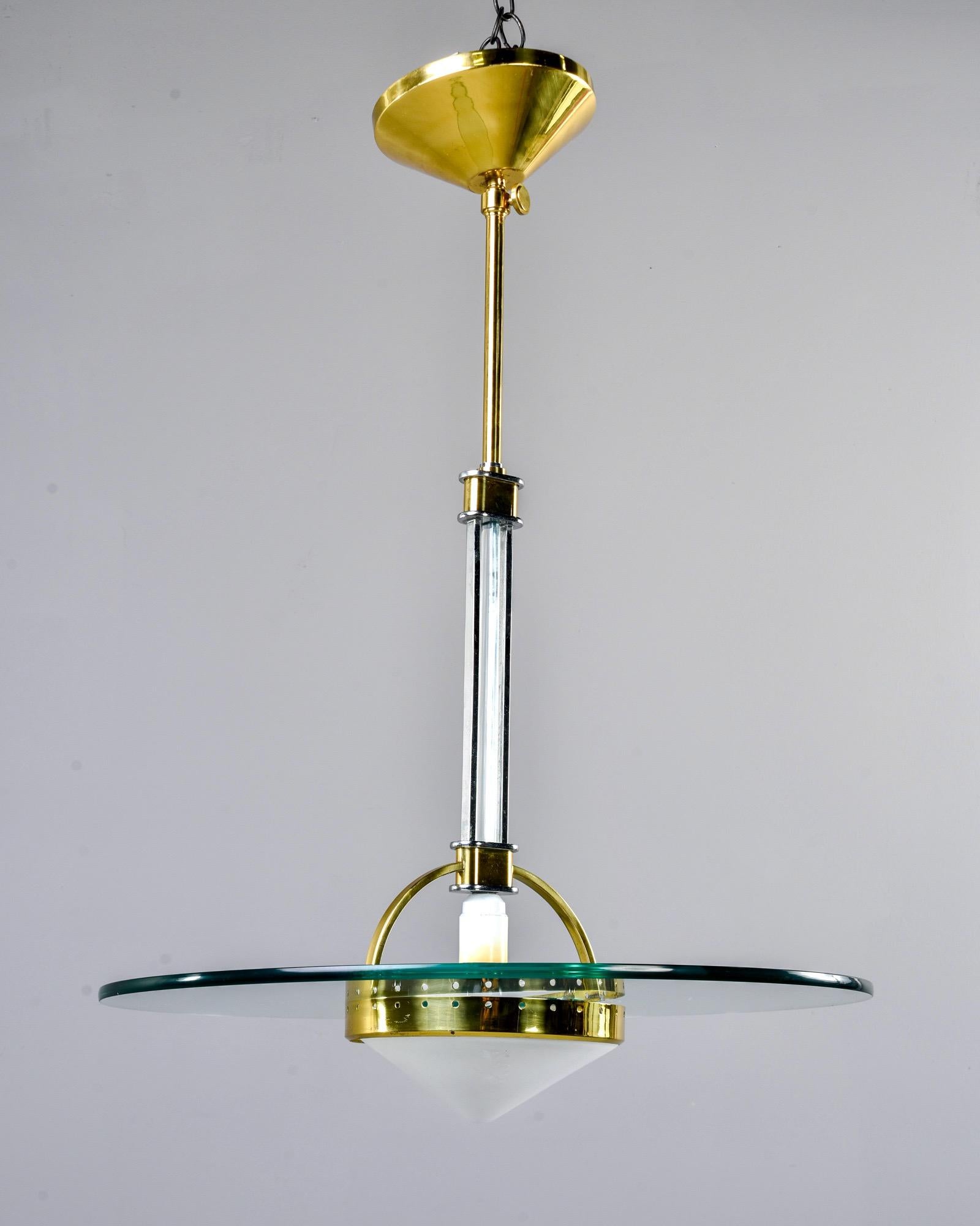 Ceiling pendant attributed to Fontana Arte lighting of Italy, circa 1970s. Polished brass ceiling canopy and fittings combined with polished nickel and sleek, Space Age style glass.

New wiring for US electrical standards.