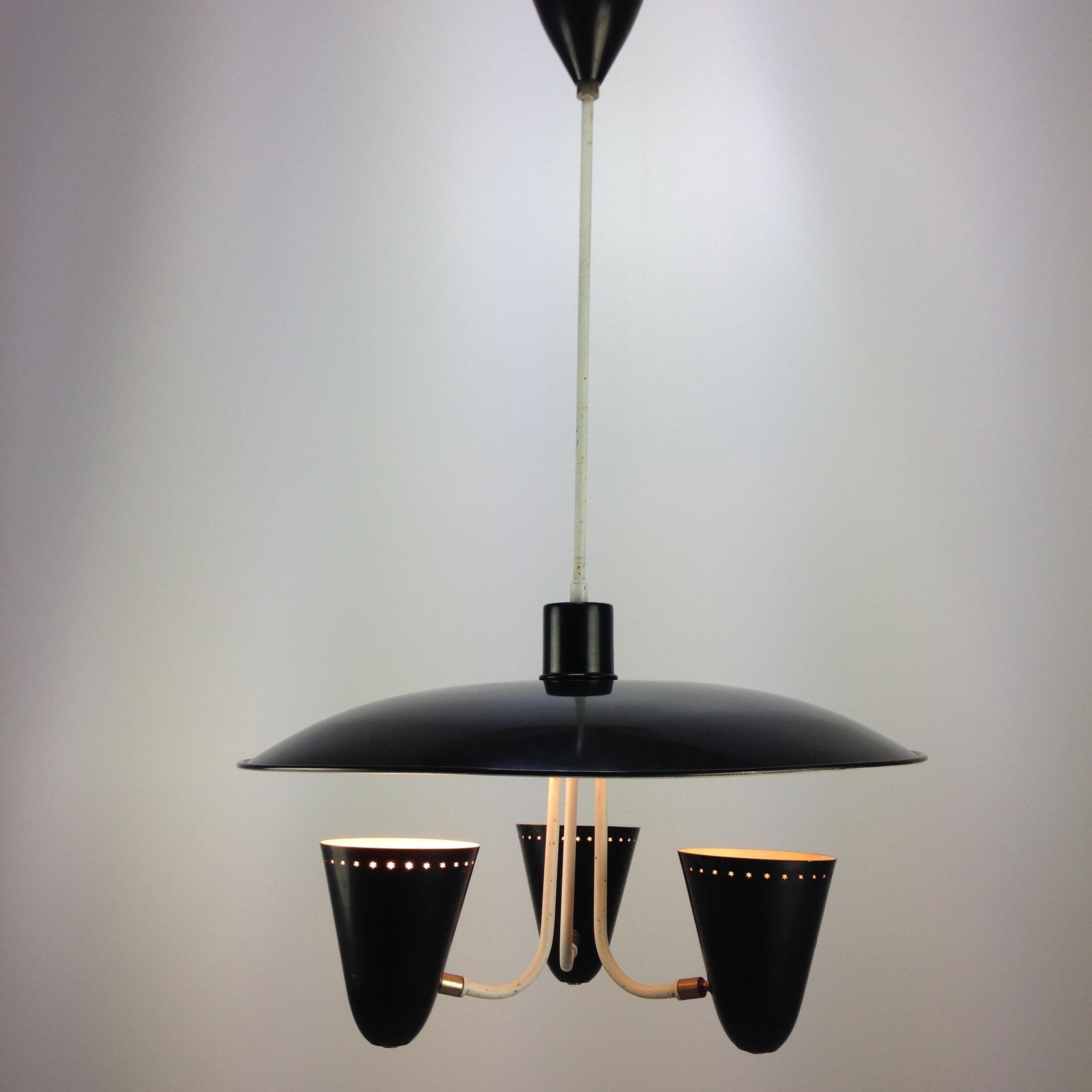 Very nice and typical Dutch 1950s ceiling lamp designed by H. Busquet for Hala Zeist, Holland 1955. 

This nicely shaped ceiling lamp has a large black lacquered reflector dish with three shades underneath in black. 

The shades are adjustable