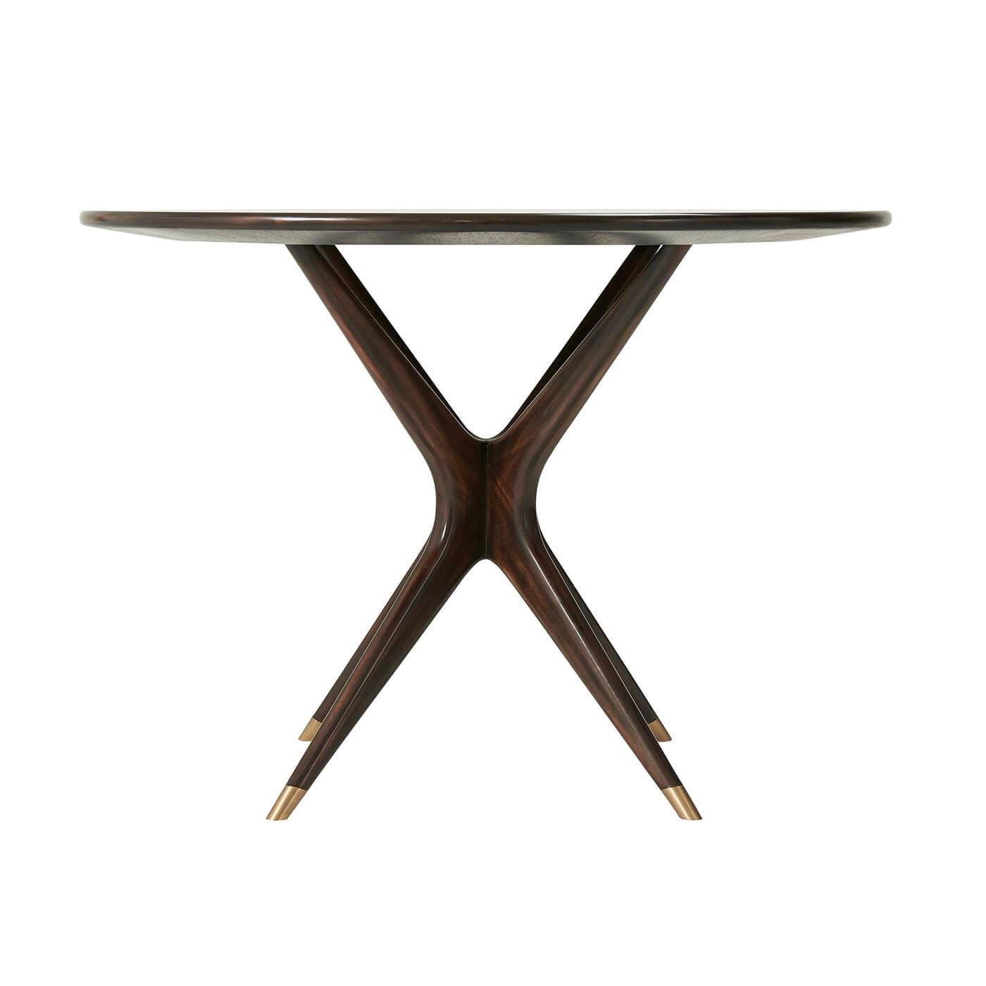 This magnificent Mid Century center table is the epitome of refined elegance and sophistication. The stunning Amara ebony veneer, combined with the rich ebonized mahogany and brass accents, creates a captivating contrast that will elevate any