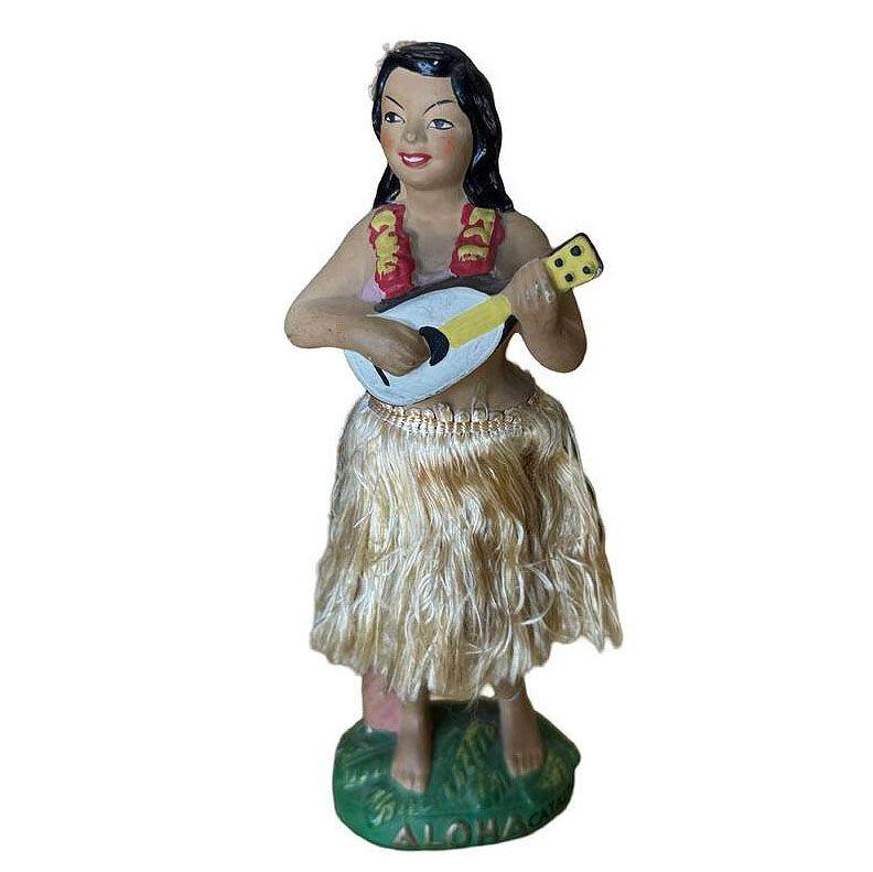 Original post-war ceramic chalkware dancing Hawaiian Hula girl figurine made from lightweight plaster and painted in vibrant tropical colors. It depicts a young Hawaiian hula dancer in traditional attire, posed in a hula dance with a ukulele.