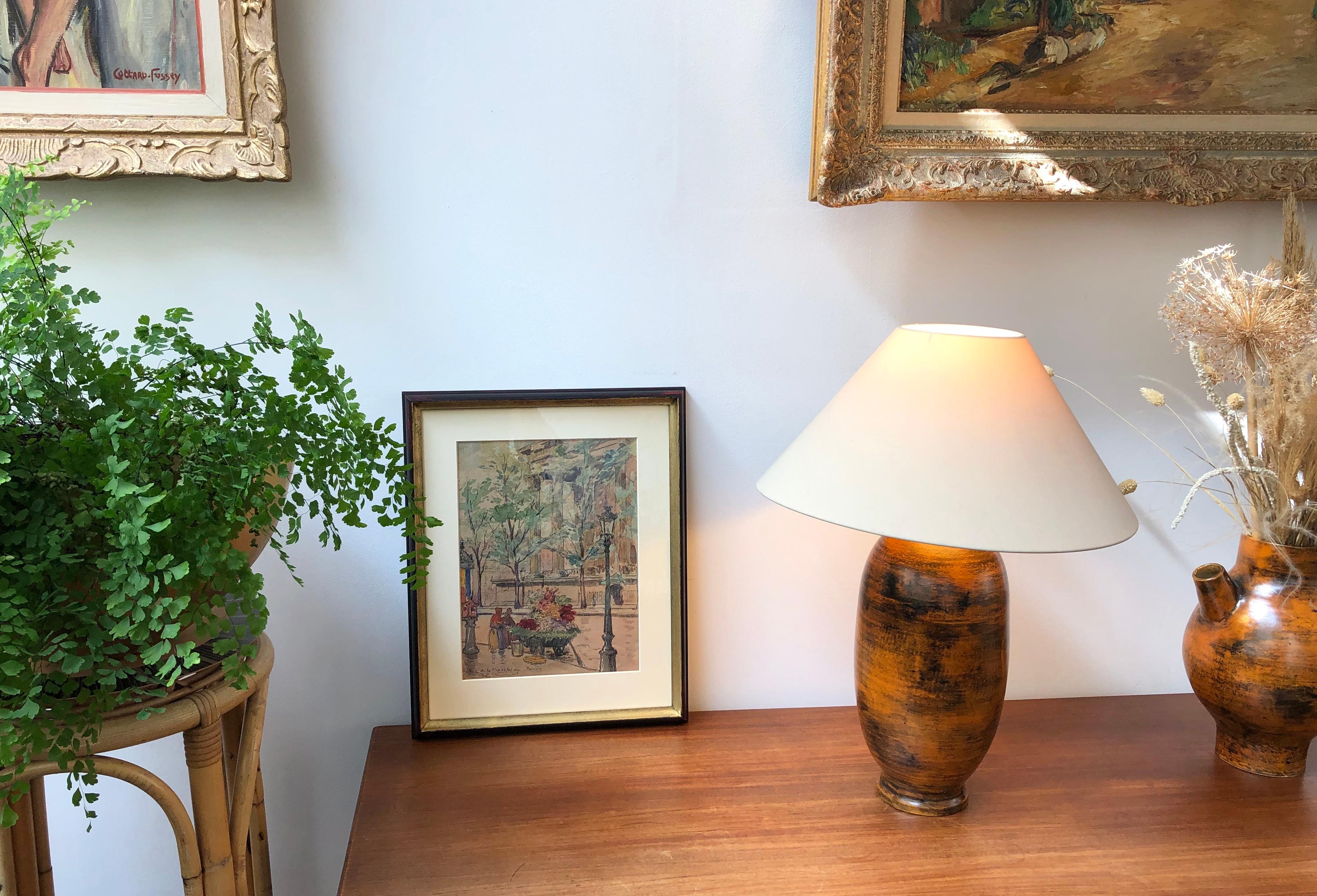 Midcentury ceramic table lamp (circa 1950s) by Jacques Blin. This beautifully rust-colored French lamp (circa 1950s) is devoid of Blin's characteristic sgraffito-etchings on its surface. It is exquisite, smooth and tactile and oozes charm. In very