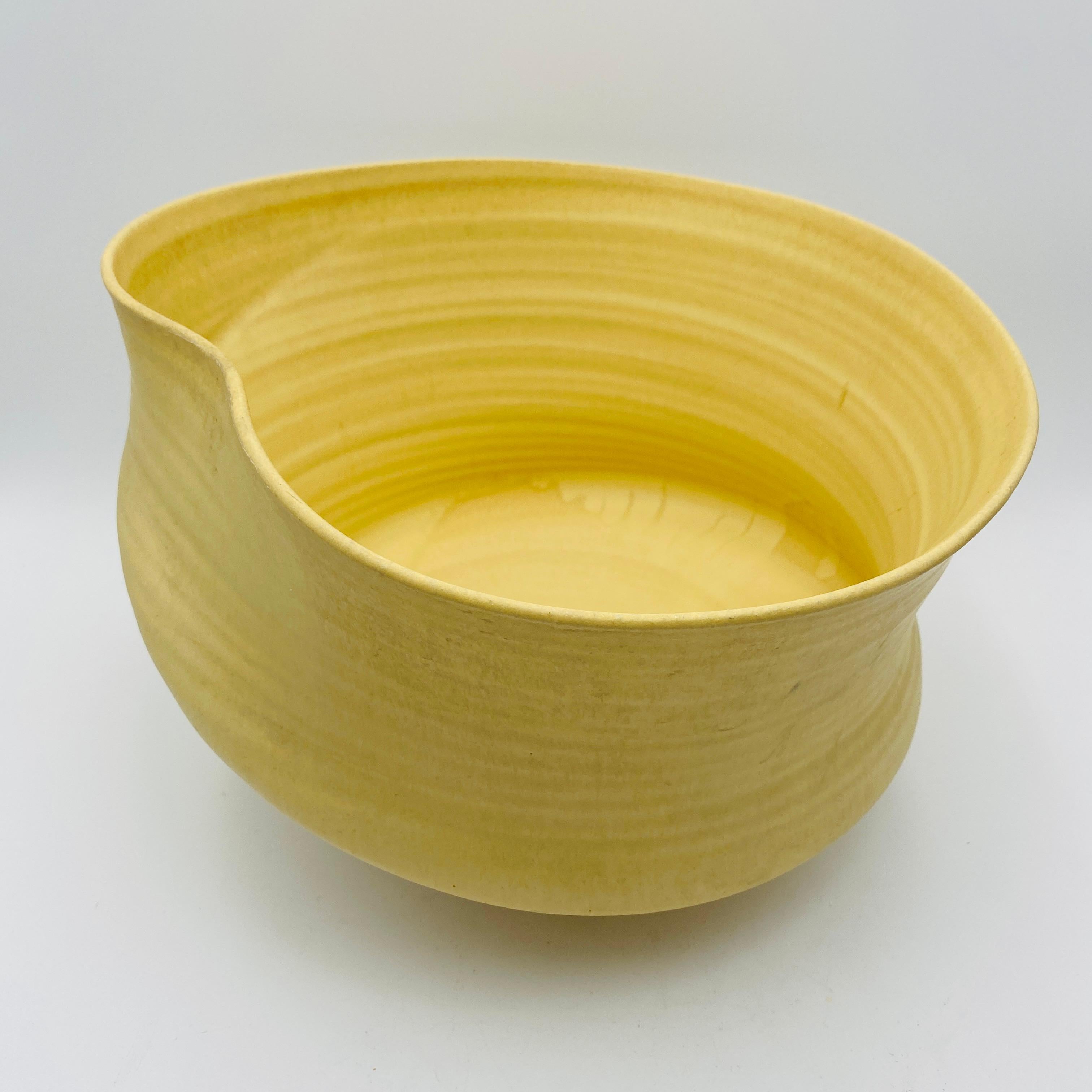A beautiful example of a California studio pottery planter with a yellow glaze. 