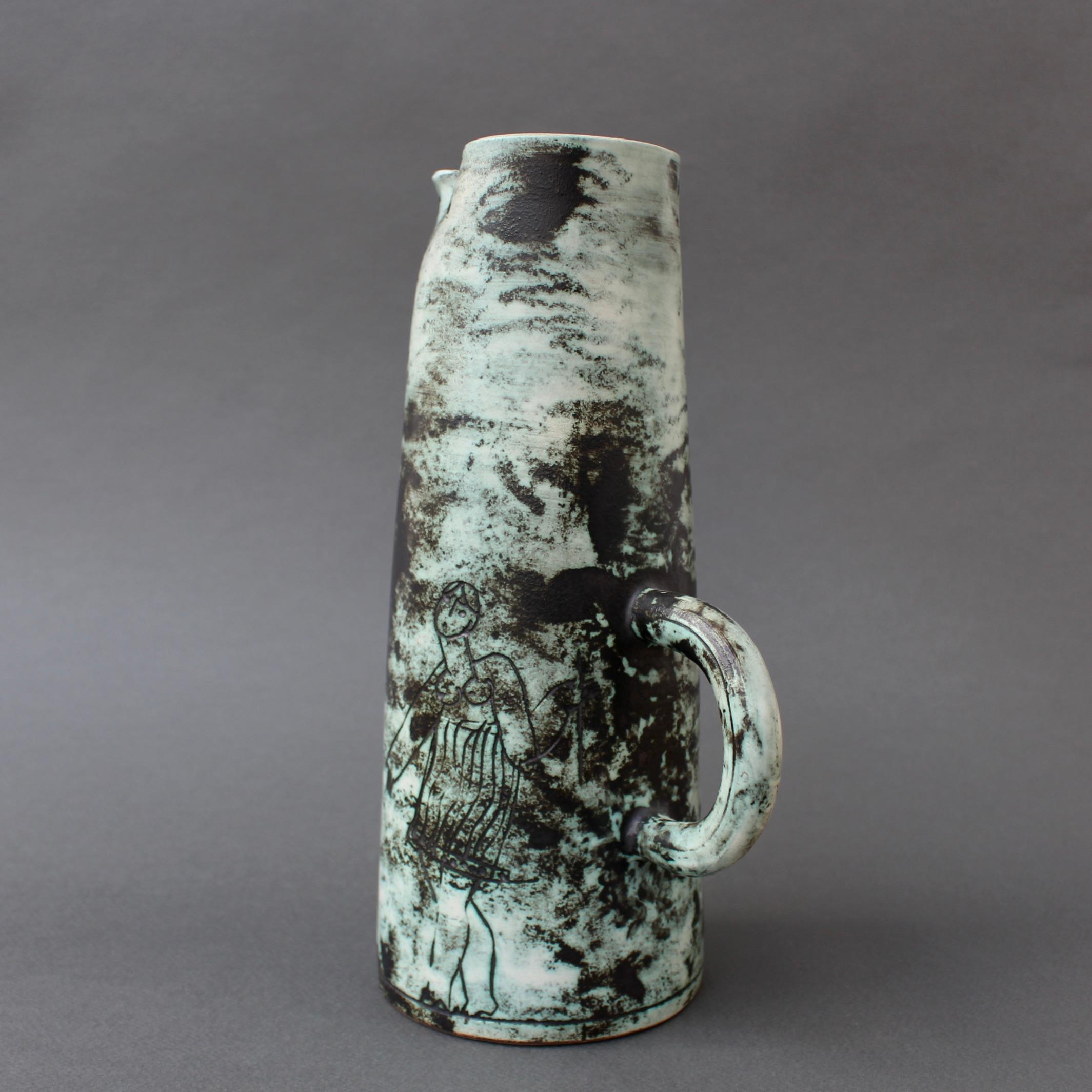 Mid-century ceramic decorative pitcher / vase by Jacques Blin (circa 1950s). Created in Blin's trademark misty glaze, this whimsical vessel is incised with fantastical creatures and stylised human figures. It is in good condition commensurate with