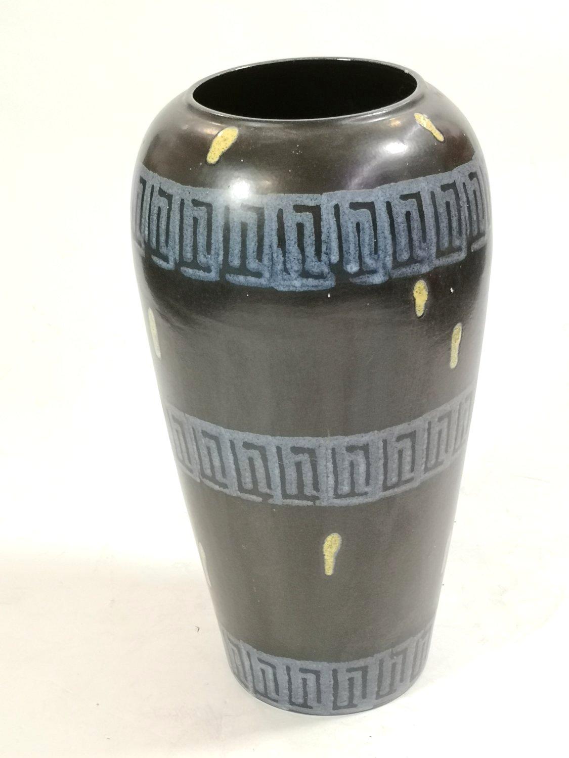 Large ceramic floor vase with black base glaze and blue Greek pattern. Vintage probably German floor vase in nice condition with special spattered yellow spots. Marked 51750 on the bottom. In excellent condition. Special unique handwork from the