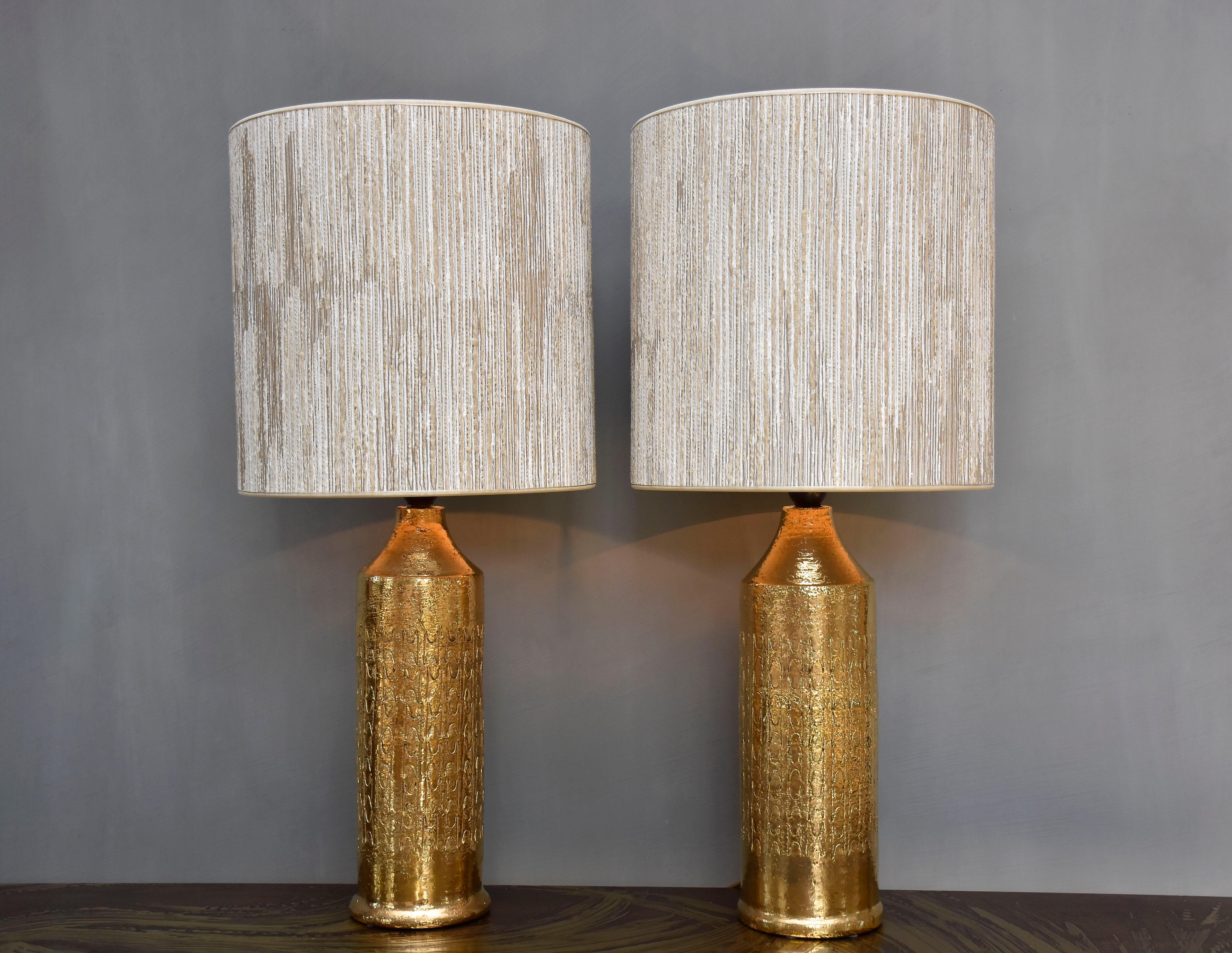 An elegant pair ceramic table lamps designed by Bitossi for Bergboms- Sweden.
These fabulous lamps are glazed and gilt.
Period- ca. 1960-1970
Place of origin- Italy/ Sweden
Labeled at the bottom

Including new luxurious high quality hand made