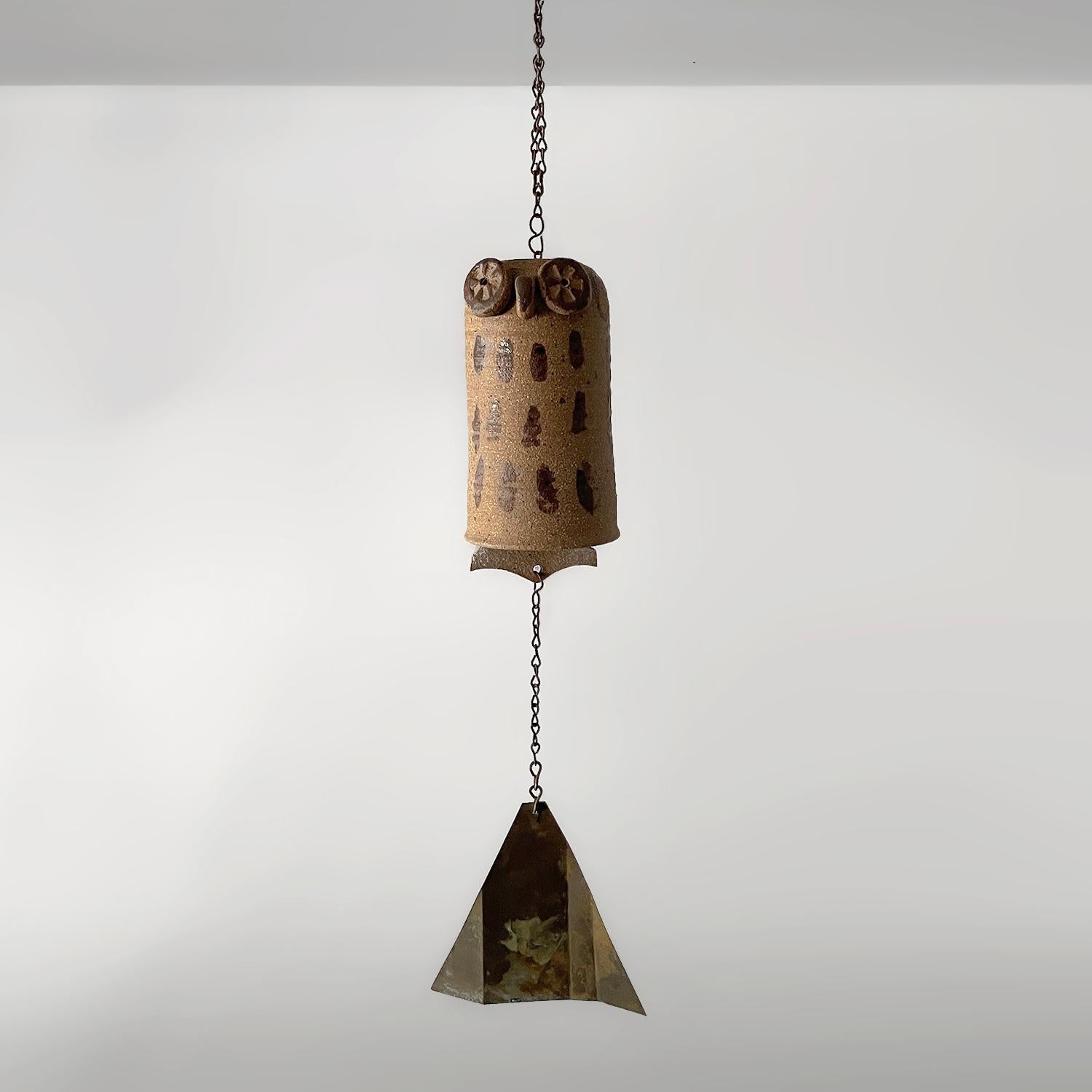 Elevate your outdoor space with this charming artisanal piece 
Organic composition and feel 
Sculpted ceramic stoneware owl is suspended from a metal chain link cord
Light surface markings
Patina from age and use
Perfect present for the