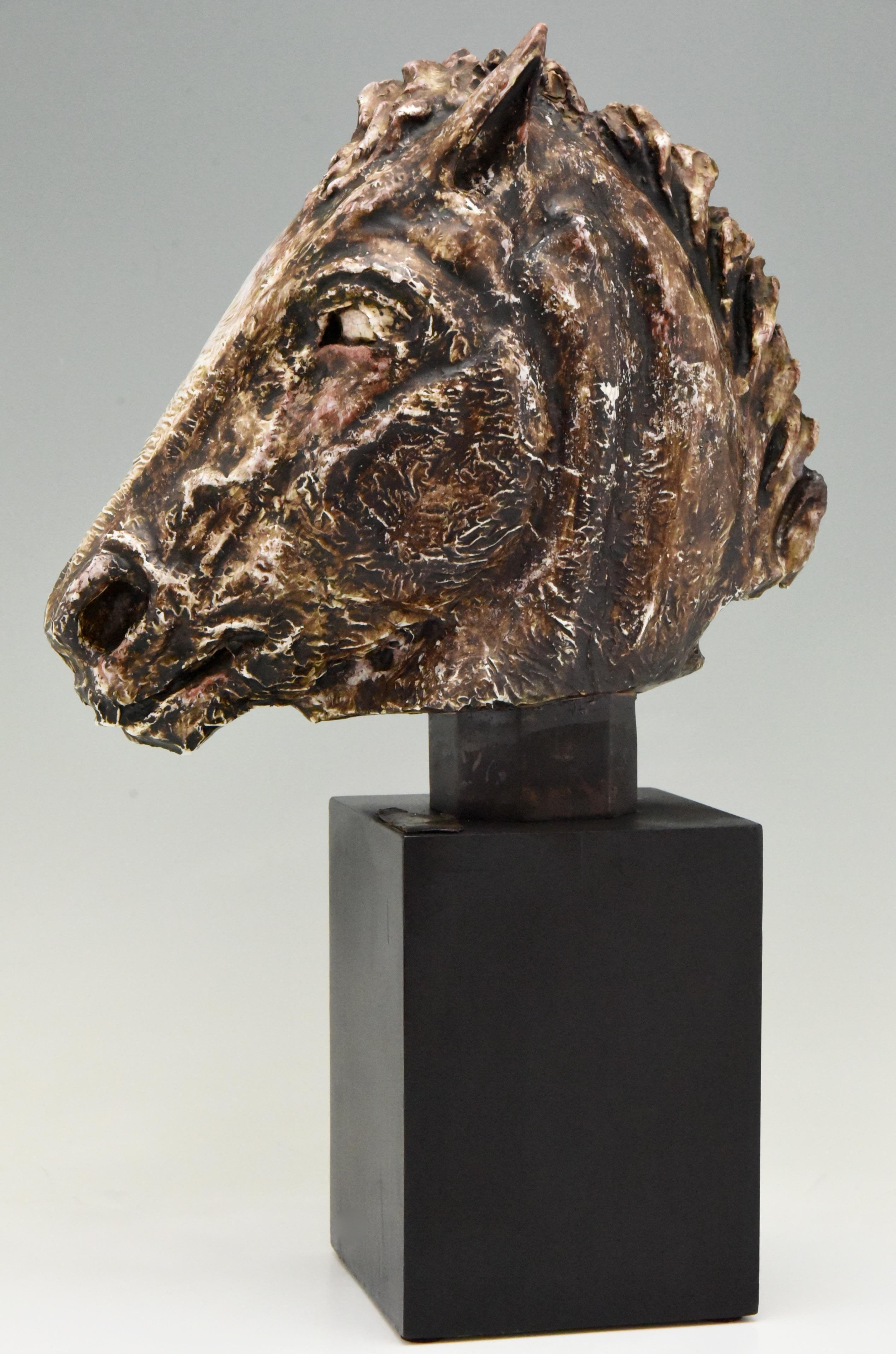 Midcentury ceramic sculpture bust of a horse with brown and white glaze. The sculpture is signed Schor on the wooden base,
circa 1960-1970.