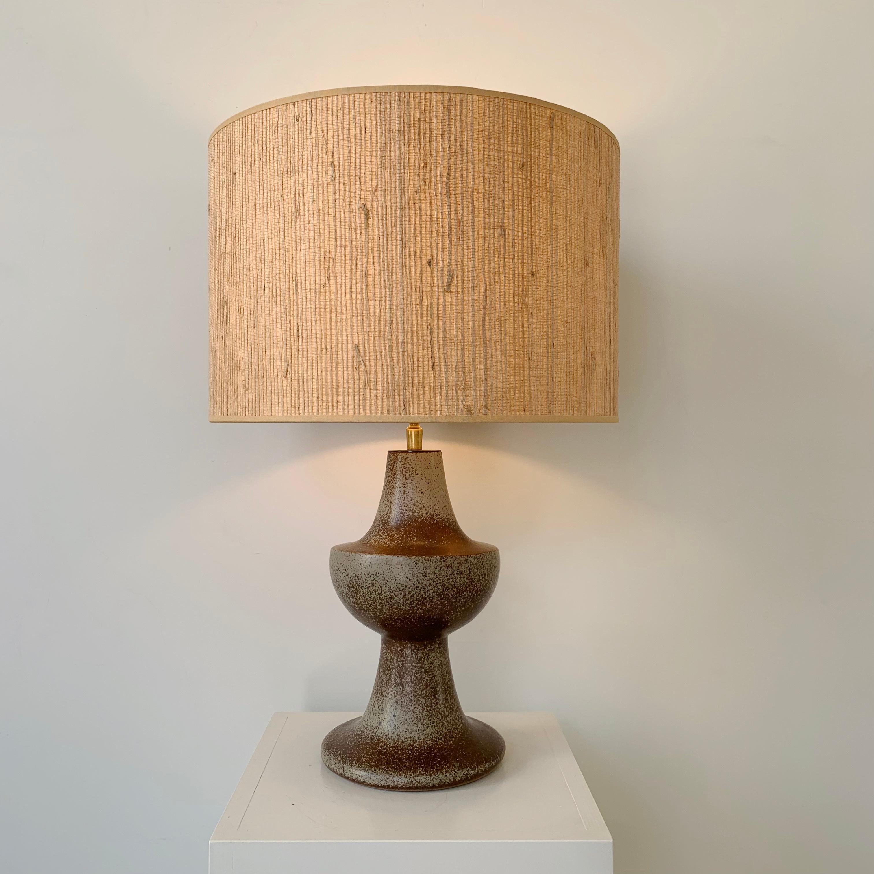 Midcentury ceramic table lamp, circa 1960, France.
Enameled sandstone, new straw shade.
Rewired, one E27 bulb.
Dimensions: total height: 56 cm, Diamter of the shade37 cm.
Good condition.
All purchases are covered by our Buyer Protection