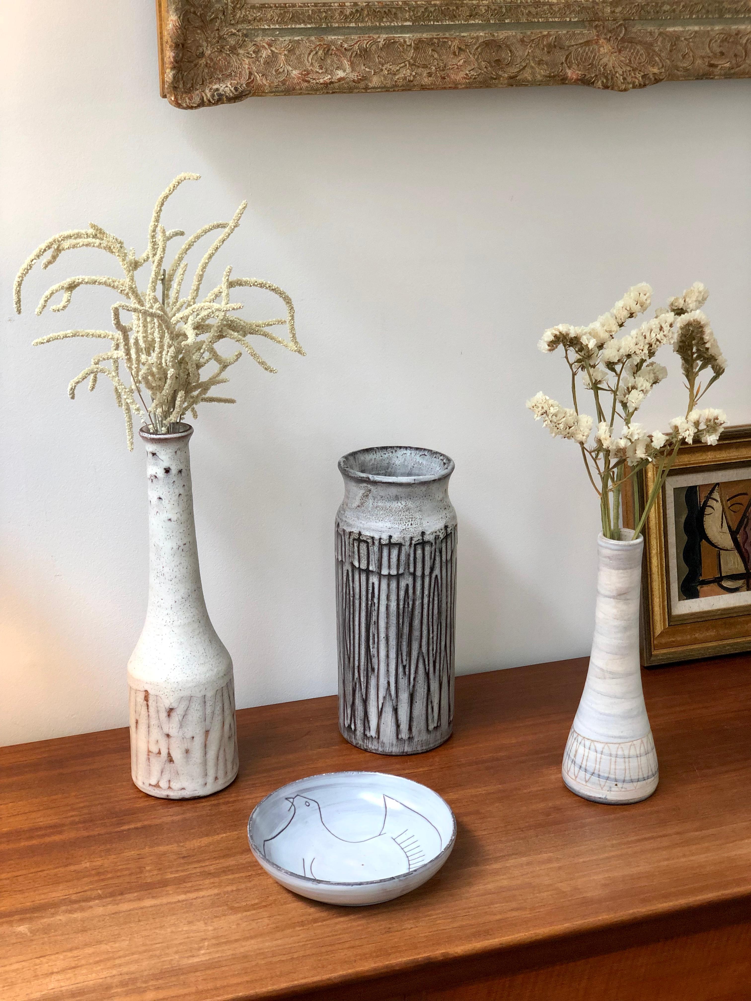 Midcentury ceramic vase by Jacques Pouchain - Atelier Dieulefit (circa 1960s). Classically-shaped, elongated vase in Pouchain's signature cloudy glaze with an elegant matt white base and subtle blue swirls from top to bottom. A contemporary motif