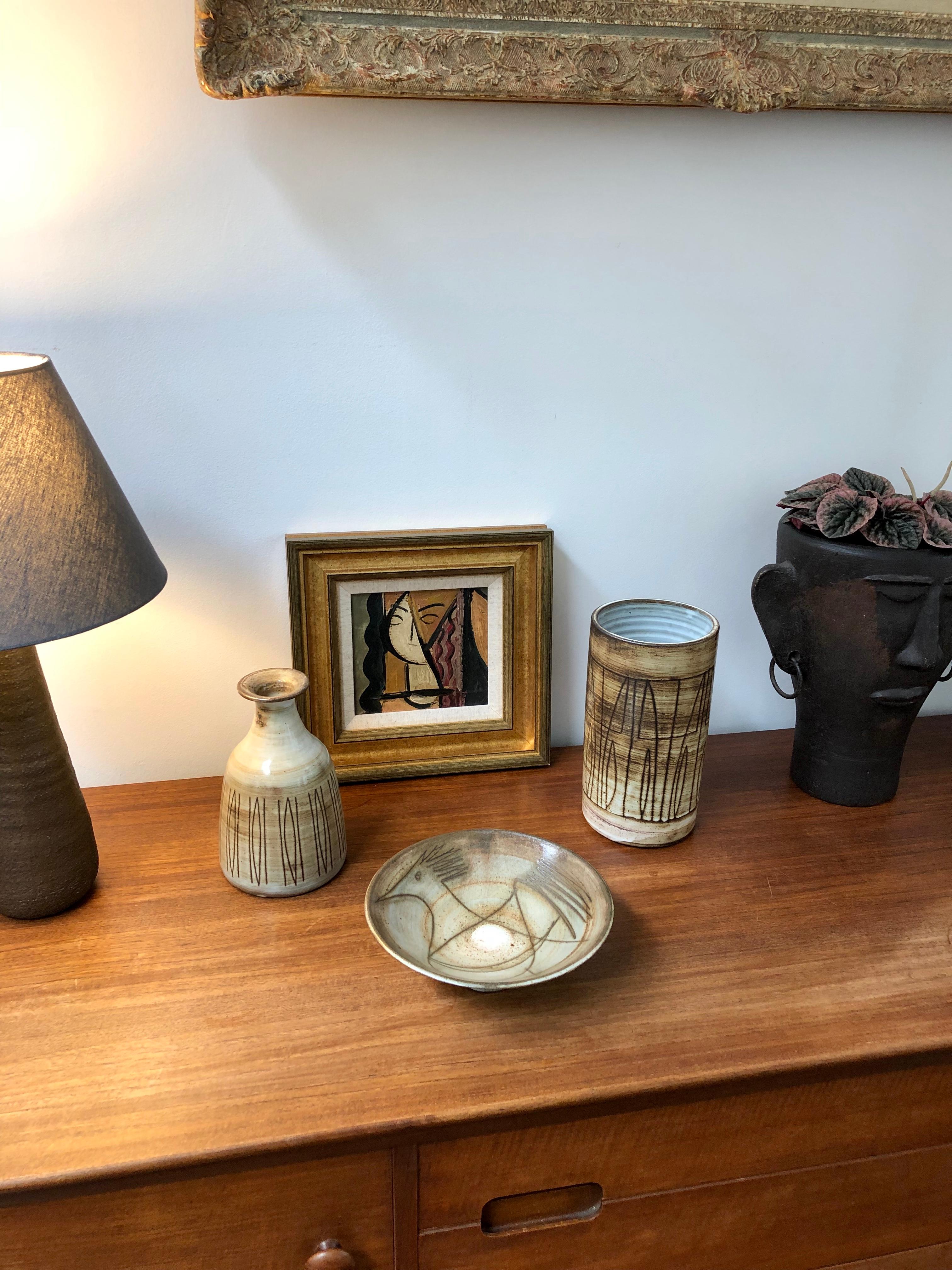 Midcentury ceramic vase by Jacques Pouchain / Atelier Dieulefit (circa 1960s). Classically-shaped vase in Pouchain's signature cloudy glaze style with earth tone hues. It is elegant with a contemporary motif surround of lines and geometric shapes.