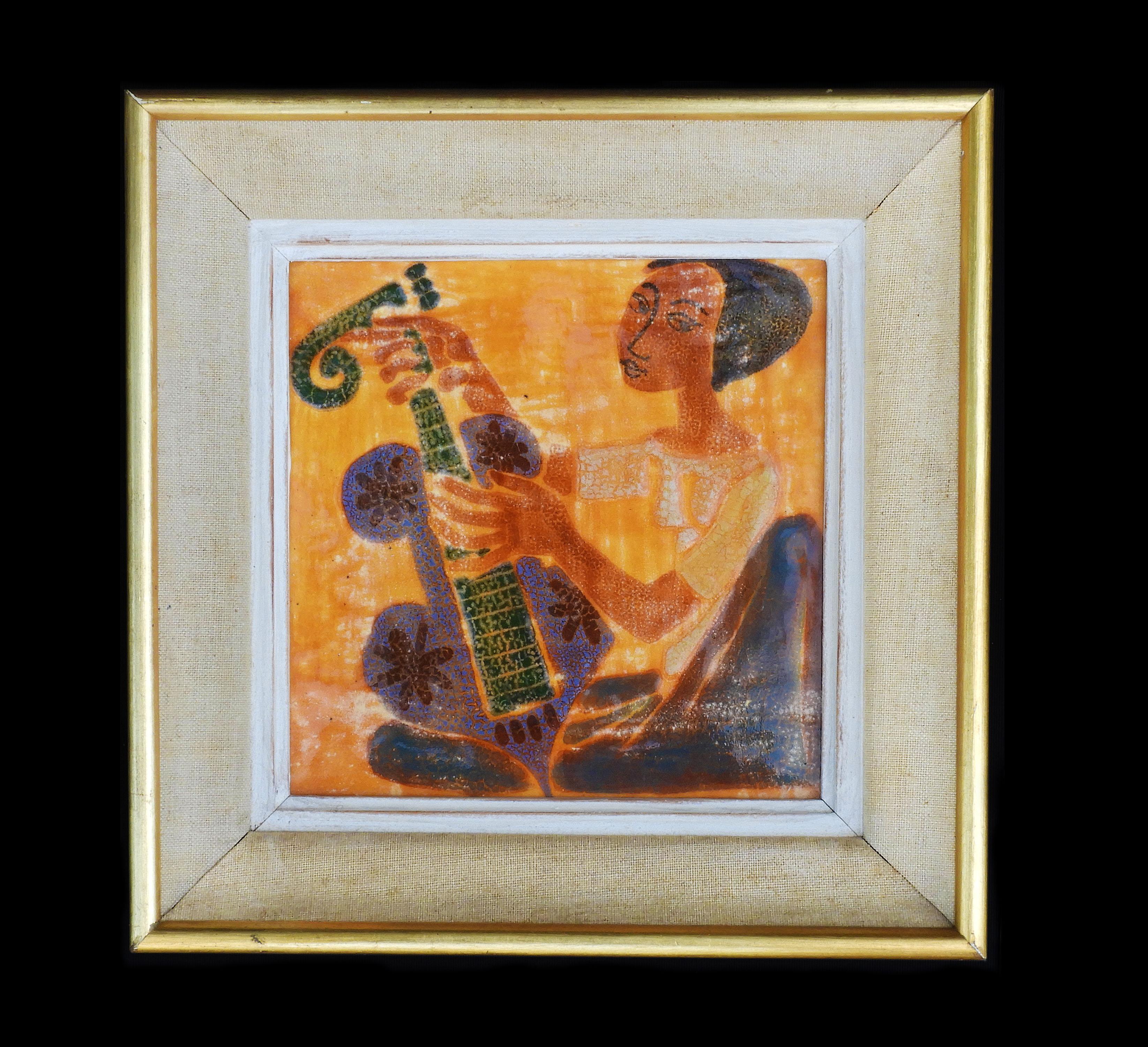 'Girl Playing Guitar' Mid-Century Ceramic Wall Art C1950.  Hand-painted, textured ceramic with strong colours and a high gloss glaze. Artist unknown. Framed and ready to hang.  In very good vintage condition, no cracks or losses to ceramic.  Minor