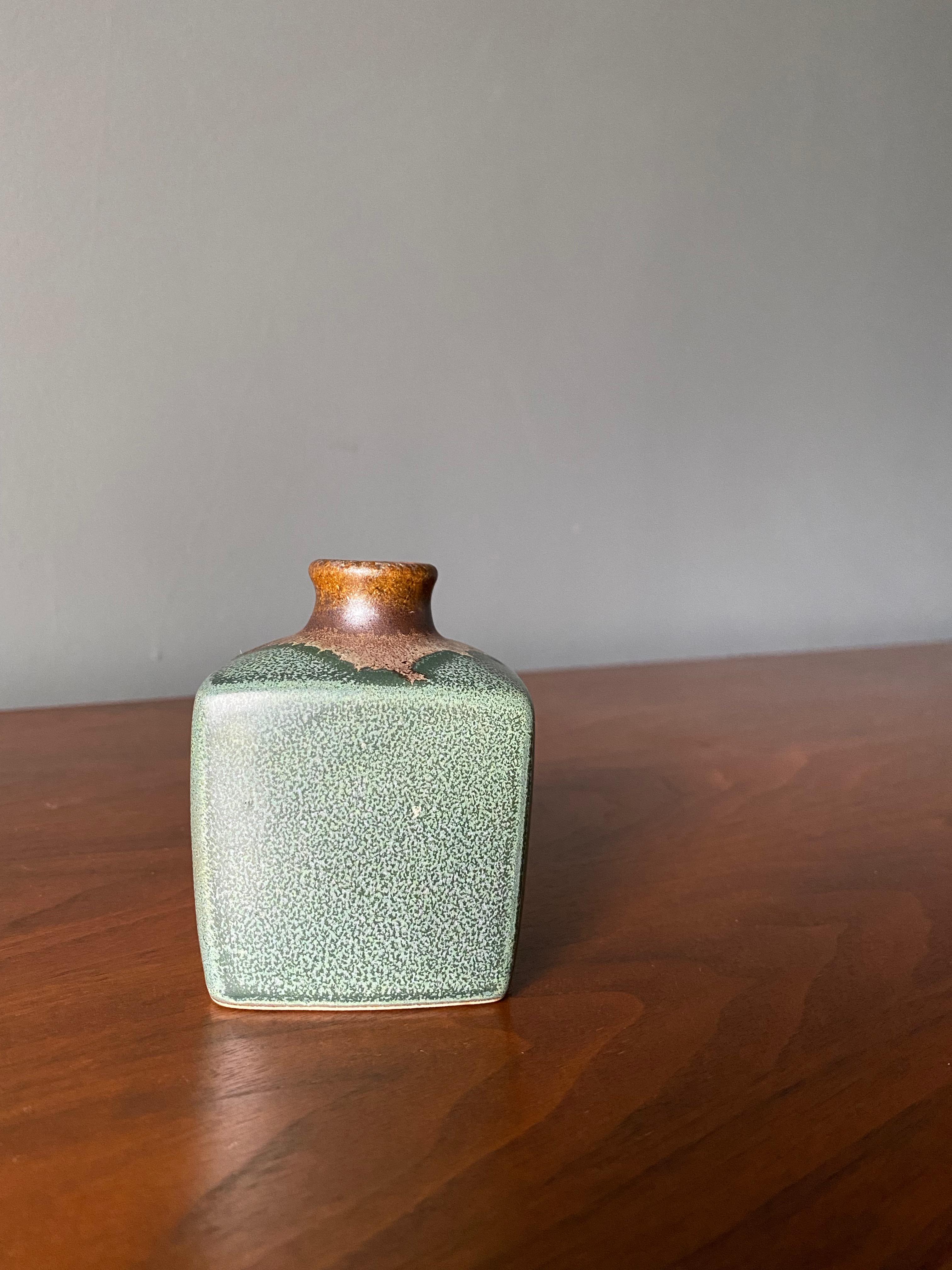 Vintage weed pot or bud vase. Beautiful green glaze. An excellent accent piece in any home or office.