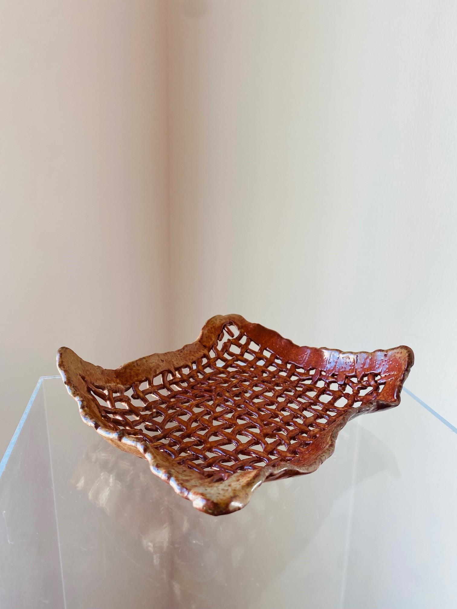 Incredibly beautiful finished ceramic art piece.  This vintage mid-century piece is unique as it is interesting.  Crafted with artistry to resemble a woven finished piece, this beautiful work of art mimics the texture and grain of real woven fabric.